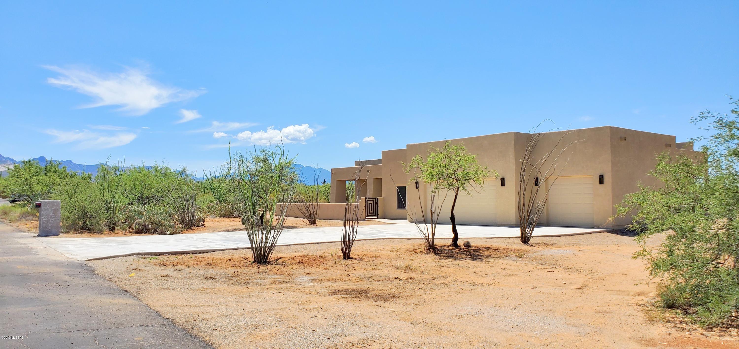 New Construction on 4.15 Acre lot with beautiful mountain views in the gated community of Sycamore Springs - 2700 SqFt, 3 bedrooms + den, 2 1/2 baths, 3 car garage. Enter the home through the impressive double bronze wrought iron doors into a spacious light and bright great room with large picture windows that enhance the views, french doors to the back patio and a cozy wood burning fireplace to help warm up those occasional chilly days.  Kitchen is equipped with stainless steel GE Profile appliances, granite counter tops in kitchen and bathrooms, recessed lighting, ceiling fans in all bedrooms. Master bedroom has it's own french doors to the patio area. Plenty of space to bring your RV and toys. Award-winning Vail school district. See www.SSHOA.info for CC&R's and Community Information
