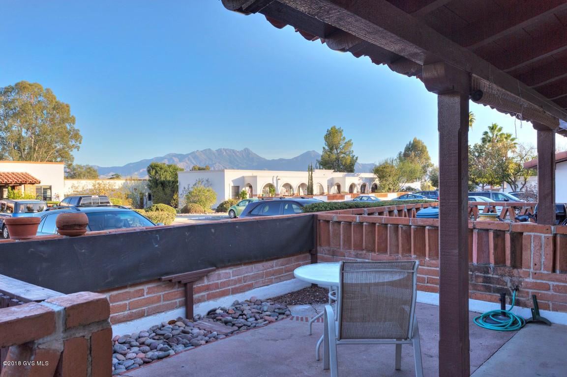LOCATION, LOCATION, LOCATION  This villa offers an east facing patio with a 1.
 MOUNTAIN VIEW, 2. Next door to the common laundry (you'll have no maintenance costs on a washer/dryer), 3. Front door parking and you can see the swimming pool from the front patio, It has newer cabinetry, granite tile counter tops, all tile floors, full size appliances and is fully furnished. The redesign during the remodeling makes this a one of a kind unit.