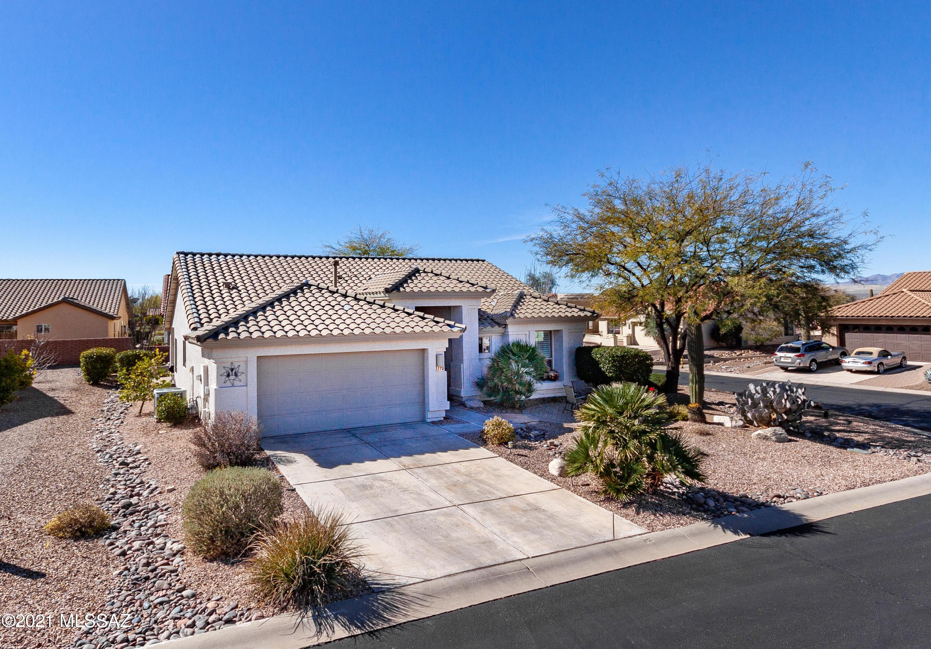 Meticulously maintained, on a large corner lot  this one-owner home is lived-in just half the year. 2020 upgrades include beautiful quartz kitchen counters and backsplash, new cupboards, sink w/sprayer,  and woodgrain tile throughout. New roof was completed in 2018, PVC irrigation system added in 2020,  water heater replaced in 2018 and dishwasher in 2019,  front security door added in 2017. Interior painted in 2020 with accent colors.  Large master bedroom with walk-in closet and en-suite bathroom.  The den has a custom bult-in desk and cabinets but plenty of room for additional furniture. Custom garage shelving and hangers. Upscale window treatments. Entire household contents (furniture, linens, dishes, tools, etc.) available on a separate bill of sale