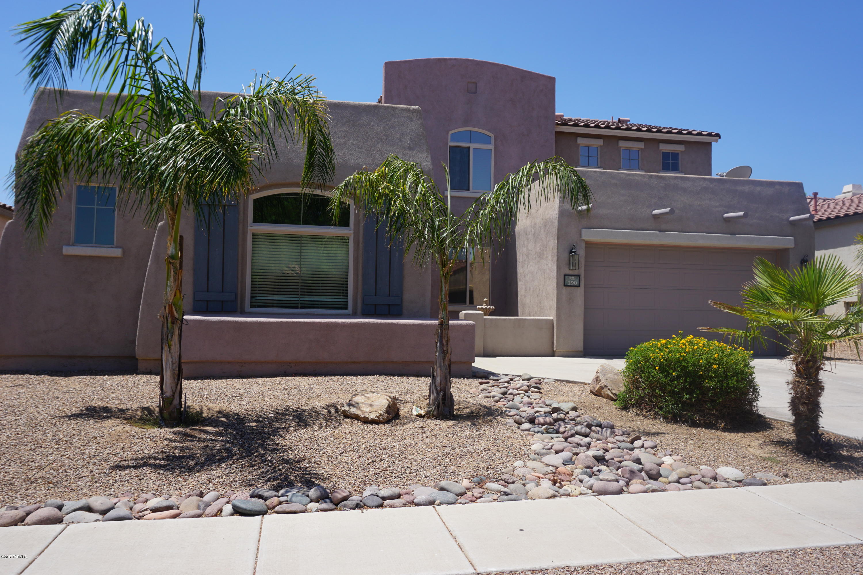 Sought after floorplan in award winning Rancho Sahuarita with master bedroom and bathroom on ground floor! Offers soaring ceilings & details with high end kitchen cabinets (extended), large island w/ corian counters, stainless appliances, upgraded tile/carpet throughout. This is a spacious, open upgraded home with a very large main floor master suite, bay windows, large bath, walk in closet, family room open to kitchen, formal living, formal dining and a den/office. While the upstairs offers three large bedrooms along with a large loft/game room and a full bath.  The back yard landscape consists of real grass, gravel and full width covered patio. HOA includes basketball court, state of the art workout facilities, jogging path, kids club, tennis, mini golf and more...
