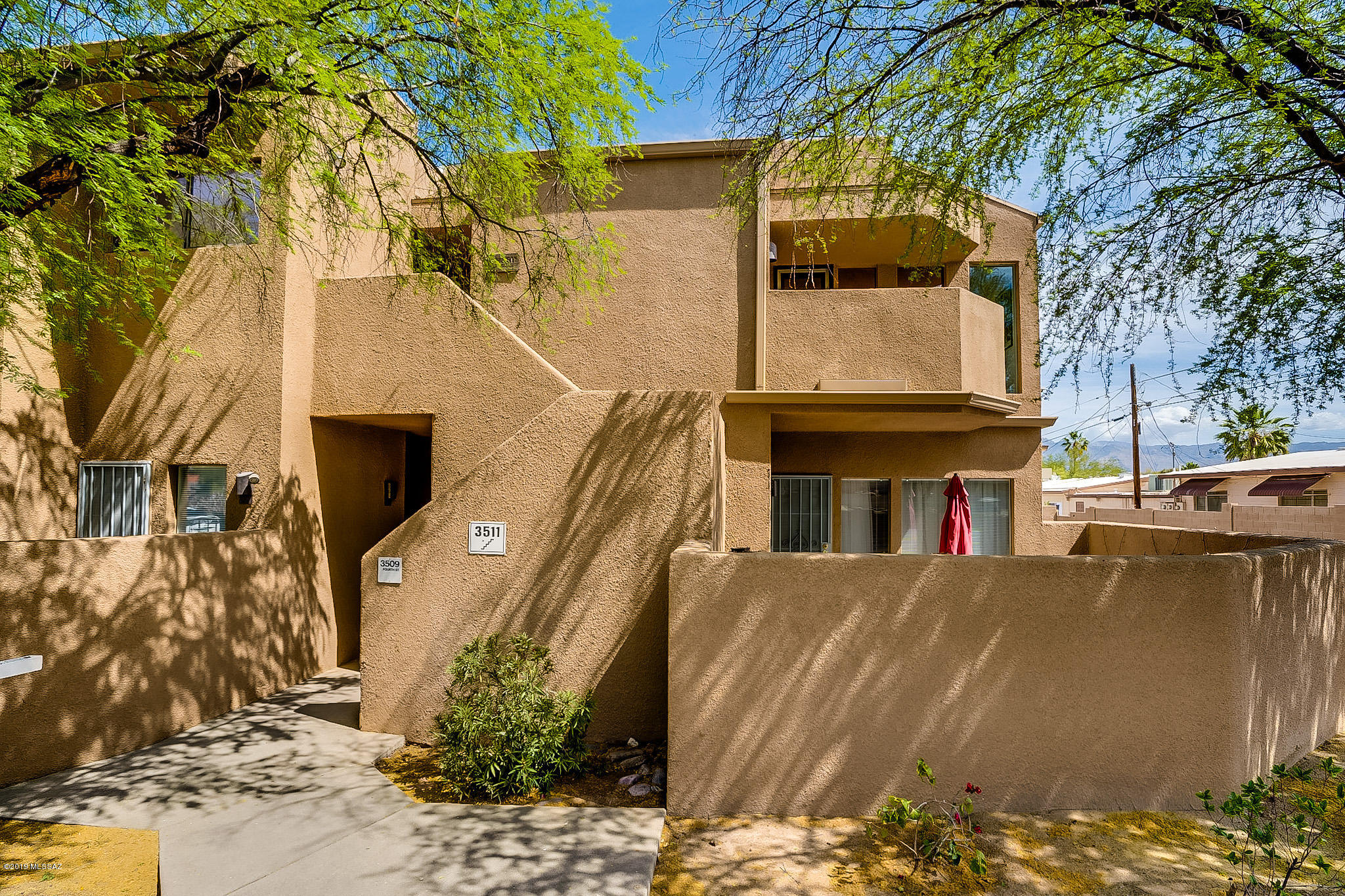 This home is located in a great central location with easy access to downtown Tucson and I-10 Freeway. The floor plan feels spacious, bright, open and airy with it's high vaulted ceilings and lots of window light and mountain views. This 2 bedroom 2 bath offers 2 balconies, dining room and a dramatic living room with a fireplace. One car garage, Laundry closet with Washer and Dryer included. Private 5 unit building shares community pool. Could also be a great rental or vacation home.