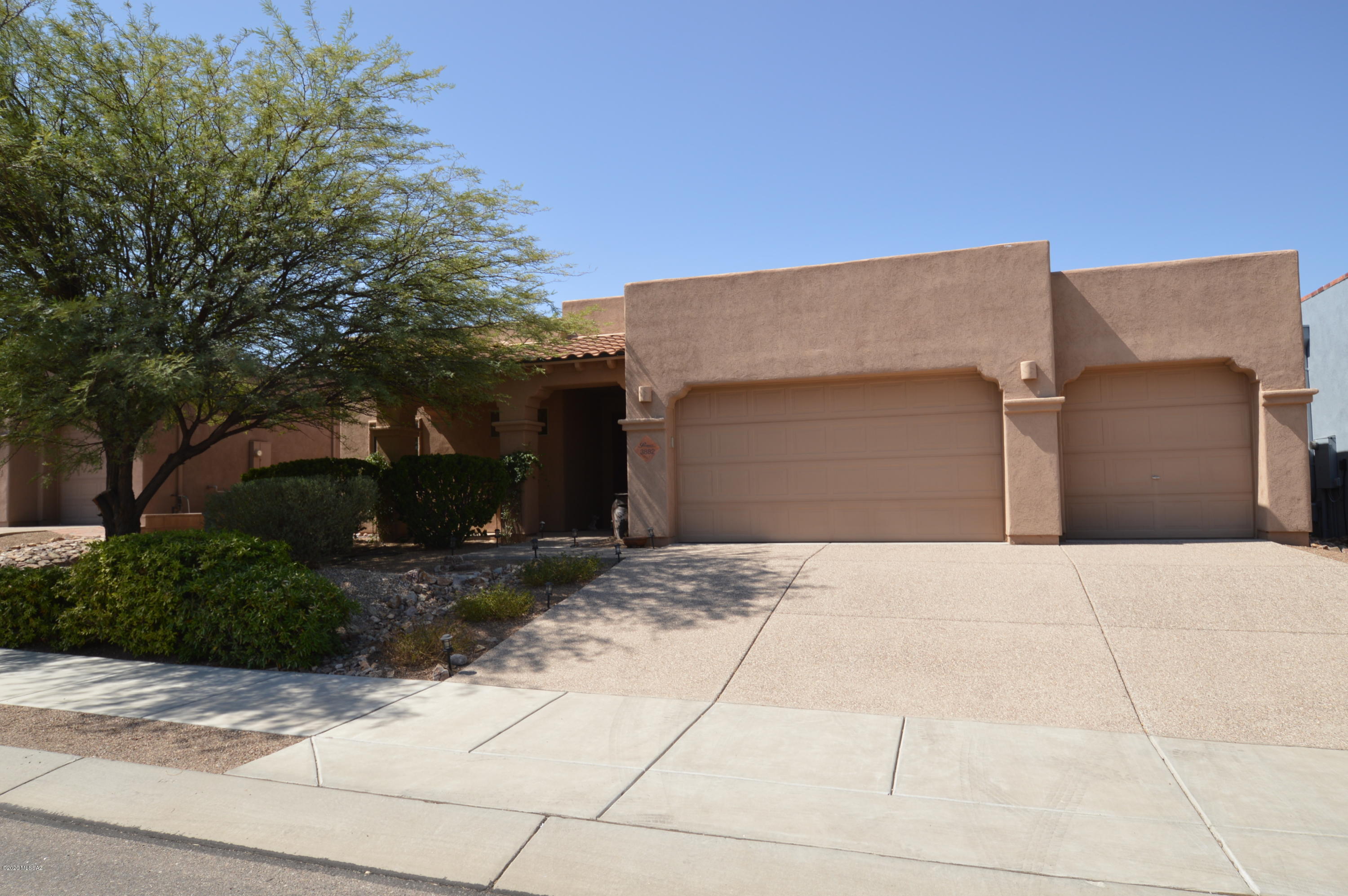 Stunning home in Sierra Pantano. Original owner, immaculate!  10' ceilings throughout, totally tiled.  Gourmet kitchen with rich granite counters and stainless appliances. Open and bright floorplan, HUGE great room with lots of room to spread out.  Split bedroom plan with master suite well apart from the guest rooms.  Large den/formal dining room could be convereted to 4th bedroom.  Massing covered patio overlooks easy care yard with lots of fruit trees and producing Thompson seedless grape vines. Enormous 3 car garage provides plenty of parking and space for toys or workshop.  This gorgeous home wont last long, SO CALL TODAY!!