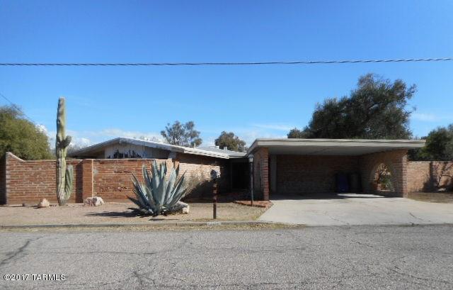 Location, Location, Location! Don't miss this opportunity to own this Central Freddie Mac Home! A unique home with architectural touches such as wood beam ceilings, exposed brick and curved wall of windows! A 2 bedroom 2 bathroom home with tons of character. Fireplace in the living room and in the master bedroom. You have to see the master bathroom! Includes a private/enclosed yard with a large pool and plenty of extra space. This home could really shine with some cosmetic repairs and updating! Come see this central gem of a home!