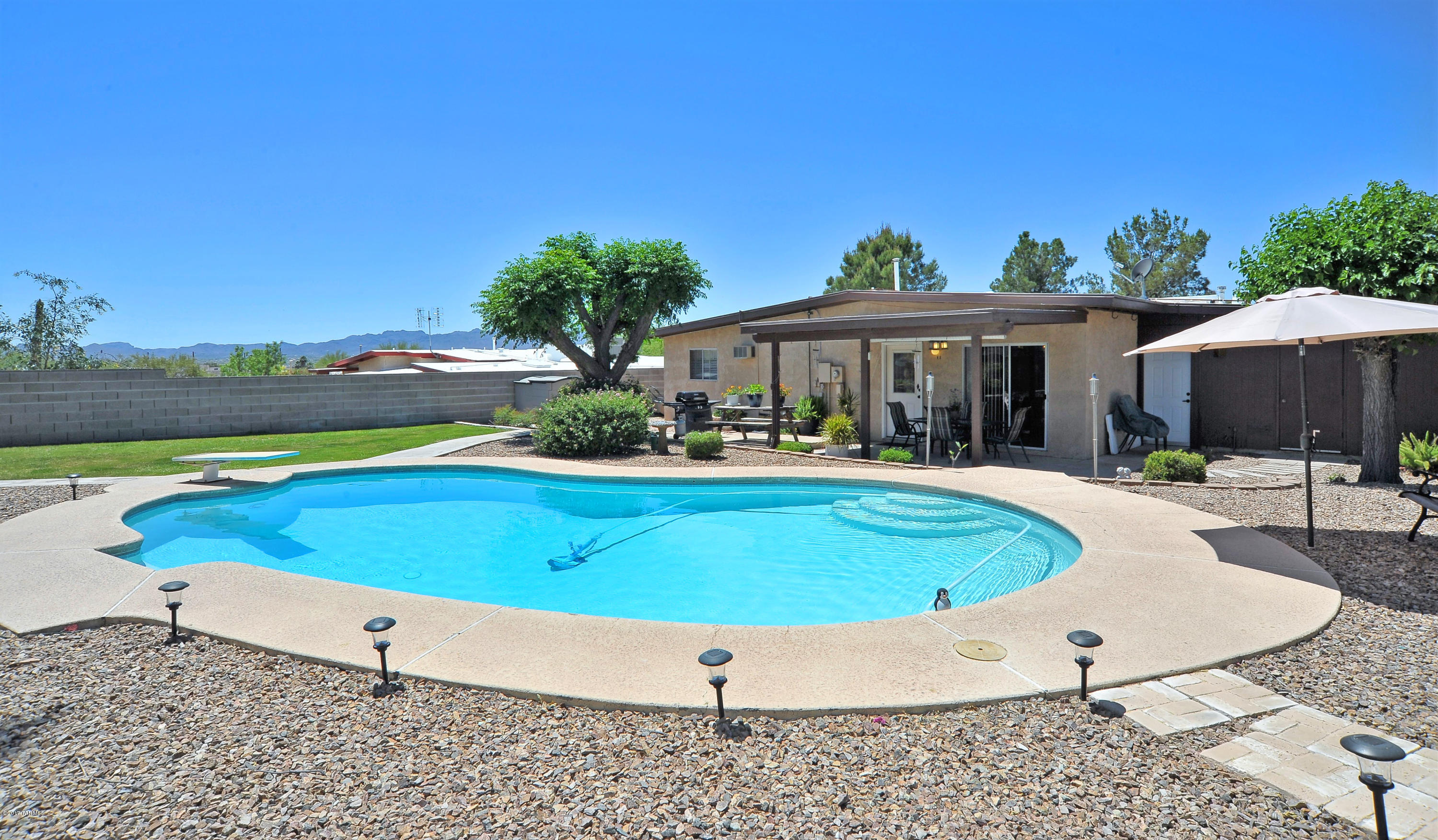 Great NW neighborhood, 4 bedrooms, 2 baths, huge family room with a wood burning fireplace that is also plumbed for gas, beautiful backyard with a swimming pool! Situated in a cul de sac, well maintained home in a desirable area! Schedule an easy showing with the owner! Owner is related to an AZ Licensed Realtor.