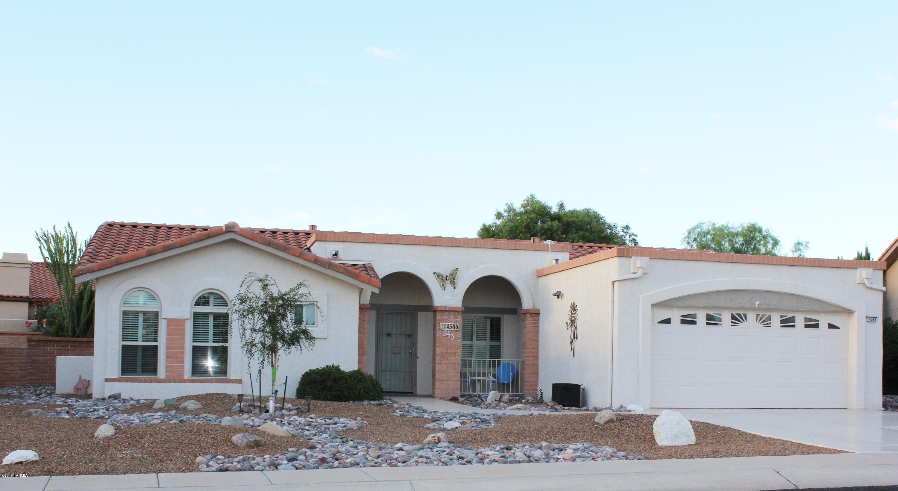 This charming two bedroom home has had tender loving care. Beautiful engineered wood flooring in the living room & dining room. Ceramic tiled kitchen, baths & back screened patio porch. Ceiling fans in living room, kitchen & bedrooms.  New windows 2013. Patio Hot Tub stays.