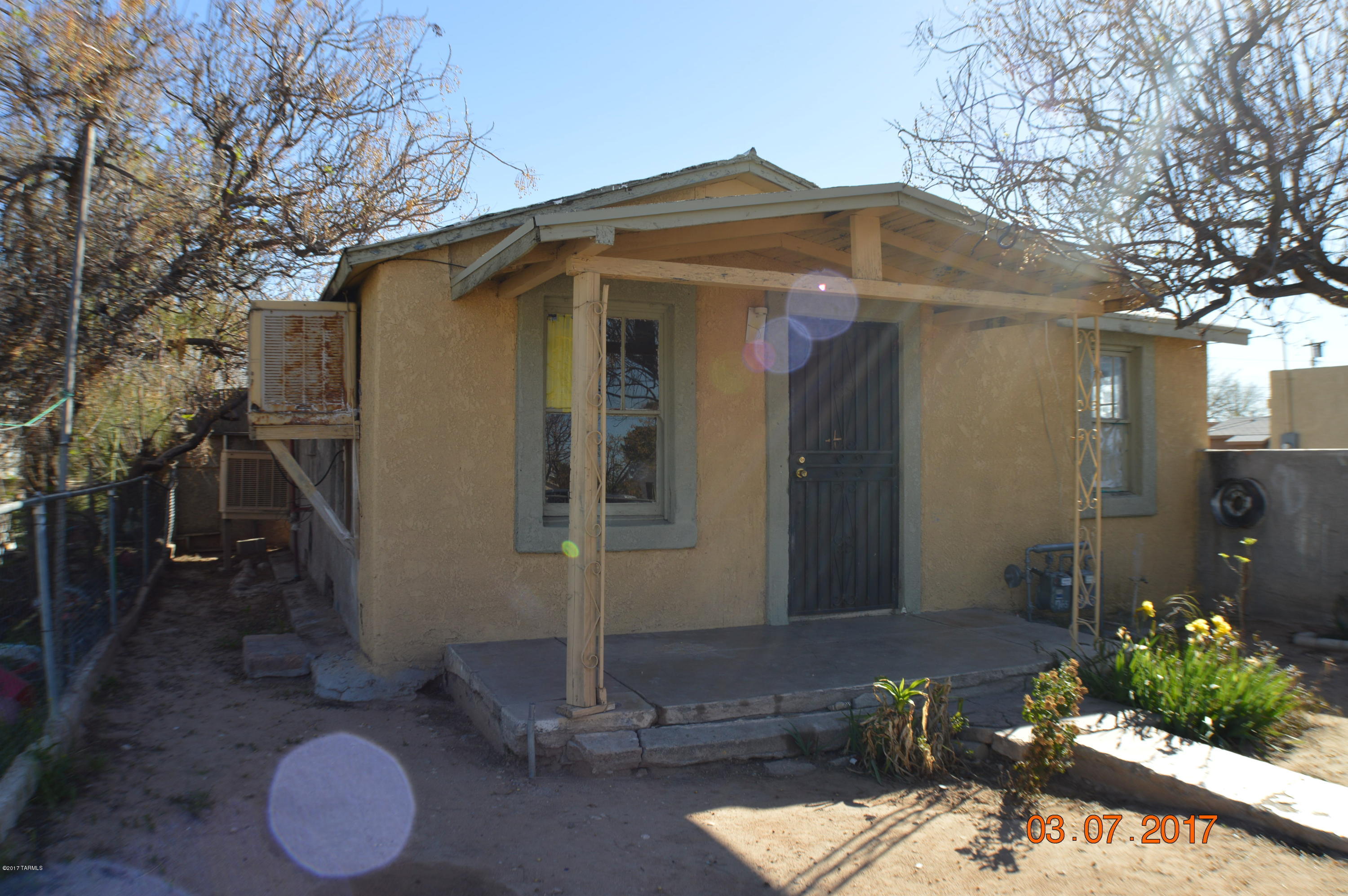 Investor special. Single Family main house with rear duplex.  Each unit has its own yard space. Main house offers 2 bedrooms 1 bath with living room, kitchen and laundry room. Duplex unit 1 is a 1 bedroom 1 bath with large living room and kitchen. Duplex unit 2 offers 2 bedrooms and 1.5 bathrooms, living room, open kitchen, laundry room and rear porch. Large detached storage shed with carport. Exterior on both structures have been plastered.  Property offers potential to be a great rental property or live in the main house and rent the duplexes out. Property being sold AS-IS.