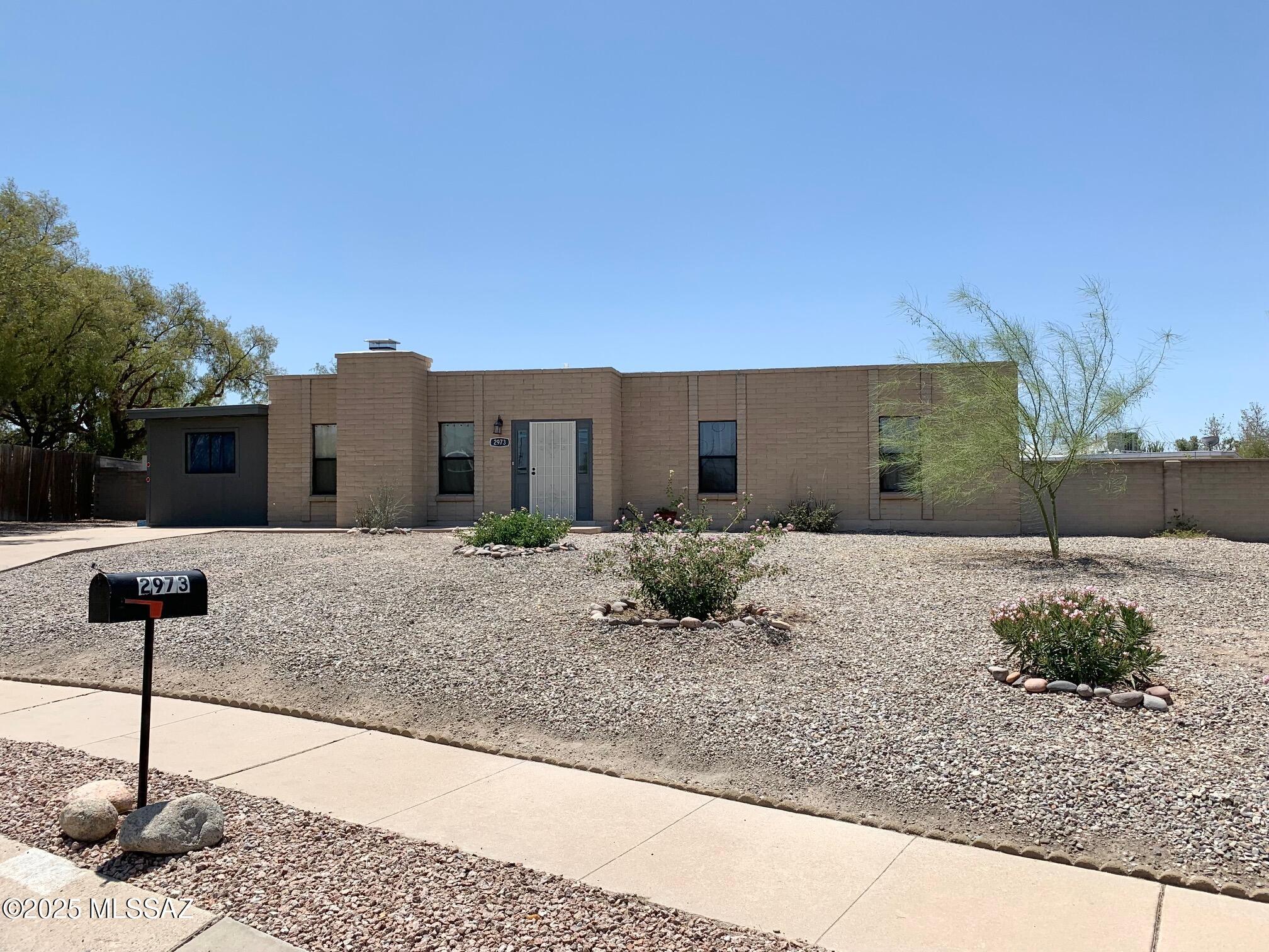 Seller offering $5,000.00 towards Buyer's closing costs! Beautiful 4 bed/2bath 1,664 sq. ft. eastside home remodeled in 2022. Kitchen with white shaker cabinets, quartz counter tops, recessed lighting and closet pantry. Designer tile showers in both bathrooms. Two tone interior and exterior paint. Living room fireplace. Ceiling fans through out. Large backyard with sparkling pool and covered patio. Roof, water heater and HVAC system replaced in 2022. Sewer lines replaced and/or relined in 2023. No HOA! Close to amenities. Move-in ready. Make this your home today!