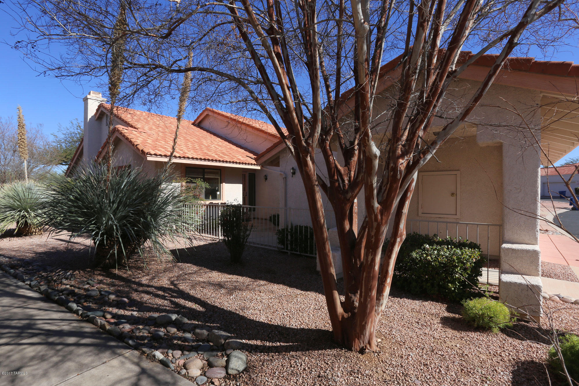 Charming townhome with view of the green at Omni Tucson National. Open and roomy floorplan offers an open area dining/living room with fireplace and a kitchen open to living areas. Wonderful outdoor area to enjoy the AZ sunshine. Nice master bedroom/bath with access to the patio. Enclosed AZ room offers a perfect place for home office or sitting area. Most furnishings available under a separate Bill of Sale (some artwork and personal items not included).