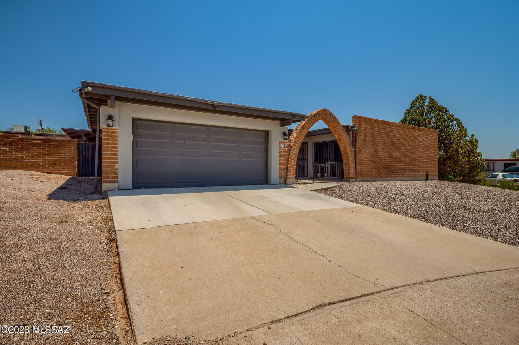 Step inside to discover a spacious and inviting layout featuring 4 bedrooms and 2.5 baths, providing ample space for you and your family to thrive. Stay cool during warm Arizona days with a brand new variable speed AC unit, while 20 solar panels ensure energy efficiency and savings. Finished backyard featuring bistro-inspired string lights, pavers, and lush artificial grass with built in sprinklers. 
Conveniently located on the east side of Tucson, this home is nestled in a quiet and sought-after neighborhood, offering the perfect balance of peaceful living and easy access to nearby amenities. Don't miss out on this opportunity to call this charming, ranch-style home yours!