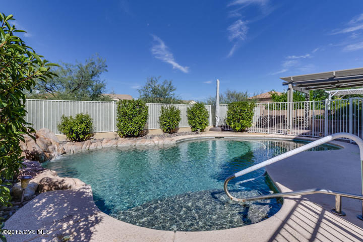 Live the Resort Life without ever leaving home! This HIGHLY upgraded Savana Model by Pulte Homes features 3,187 sq ft, 6 LARGE Bedrooms, 3 1/2 Baths, game room/loft and a 3 Car Garage. Enjoy your days and evenings in the salt-water, solar heated POOL; in your gorgeous, low maintenance backyard. View fencing and NO REAR NEIGHBORS! Enter into the Formal living and dining rooms. Notice the laminate wood flooring and upgraded fixtures. Kitchen offers upgraded cabinets with pull-outs, CUSTOM island with breakfast bar, stainless appliances and Silestone quartz countertops. DOWNSTAIRS MASTER SUITE. Upgrades include: ceiling fans thruout including the garage, HVAC with electronic scrubbers, fully insulated garage, plumbed for water softener and gas BBQ. Freshly painted exterior & most of interior.