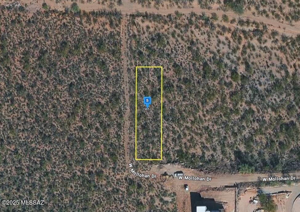 This 9,000 sq. ft. vacant lot offers stunning panoramic city and mountain views, providing the perfect backdrop for your future home. Power and public water are available, with a septic system required. Conveniently located near I-10 and I-19 for easy commuting, and just minutes from shopping, dining, and everyday amenities, this property combines accessibility with incredible scenery.