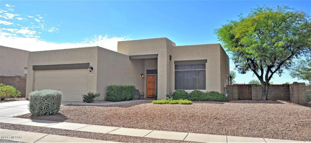 THIS IS IT! ... YOU BETTER HURRY to see this well-maintained home by the original owner. Situated on a .64 acre PREMIUM lot bordering an EXPANSIVE and PROTECTED OPEN SPACE, this home is everything that you've been waiting for! You'll feel right at home as soon as your enter. Entertain family and friends from your private backyard or enjoy Tucson's amazing sunsets... TRANQUILITY ABOUNDS HERE from your covered patio or the extended pavered sitting area. The kitchen features a gas range, 42'' upper oak cabinets and a sizable pantry. Master suite features dual vanities, a soaking tub with glass sliding doors and a large walk-in wardrobe closet.  Ceiling fans throughout. 2' x 6' construction. Exterior painted and the roof re-coated in 4/2014. New water heater in 5/2016. ALL APPLIANCES INCLUDED.