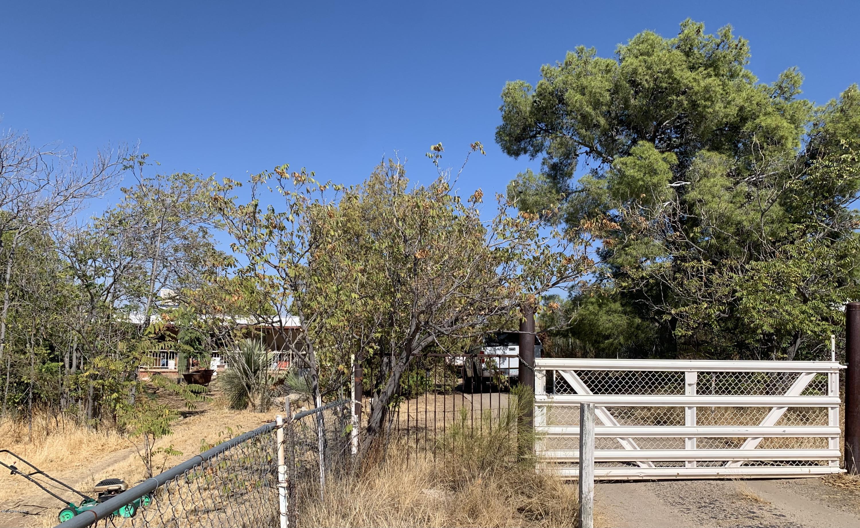 Great lot in the town of Oracle with septic, electric, natural gas, and water.  Borders state land!  Lot is zoned for manufactured or site built homes.  Horses allowed. Home is being sold in ''AS IS'' condition and is being listed with no value.