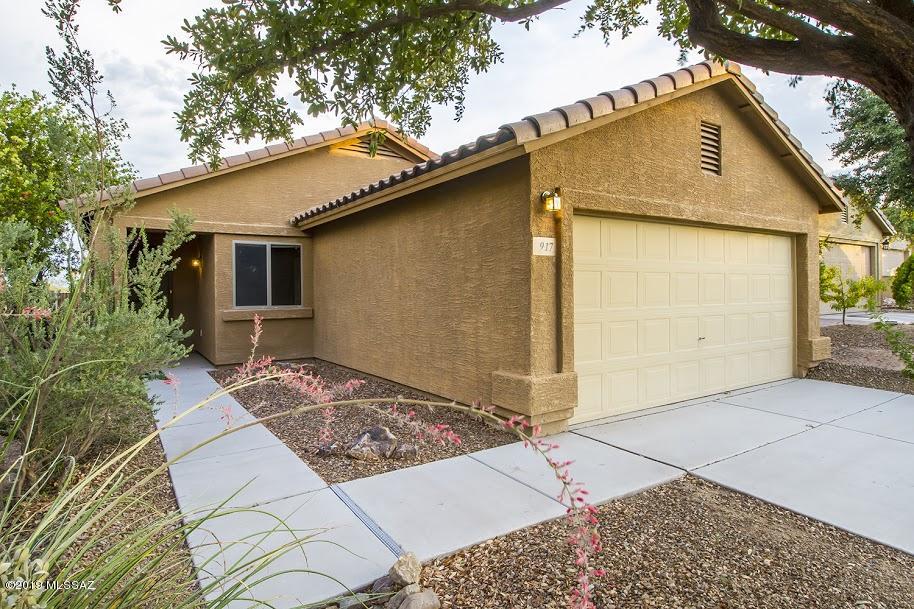 Gorgeous and literally like new!  This one story home in Green Valley's convenient Los Arroyos is a rare find and won't last long!!  Never a rental, absolutely in pristine condition.  Spacious rooms, wonderful three bedroom two bath floorplan, with eat-in kitchen.  Seller replaced range/oven with wonderful gas model.  Designer colors throughout.  Home is located near the future community garden, and the backyard is spacious and a blank slate with great southern exposure.   There's a little free library across the street!  Bring a book and take a book.  Shady patio, and a spotless two-car garage round out this amazing find!