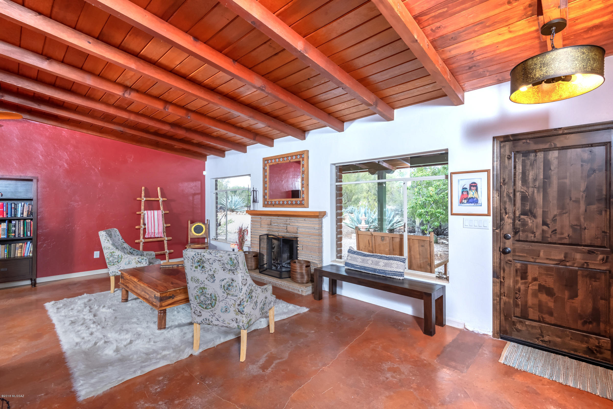 Old World luxury on over an acre of lush, private desert! In the heart of sought after Casas Adobes, this mid-century, burnt adobe estate features exquisite beamed tongue & groove vaulted ceilings, stained concrete floors and custom remodeling throughout. Quartz countertops, 6-burner professional built-in rangetop, wall oven, oversized mahogany range hood and KitchenAid Retro appliance package. Beautifully landscaped, enclosed yard with fenced 8+ foot diving pool and breathtaking Catalina mountain views. Relax on the secluded covered deck and balcony offering 360-degree panoramic views! So private yet so close to everything - Harelson Elementary or a 5 min drive to Dist 16 Manzanita Elem & Orange Grove MS. New electric, new roof, so many upgrades - IMMACULATE inside & out!