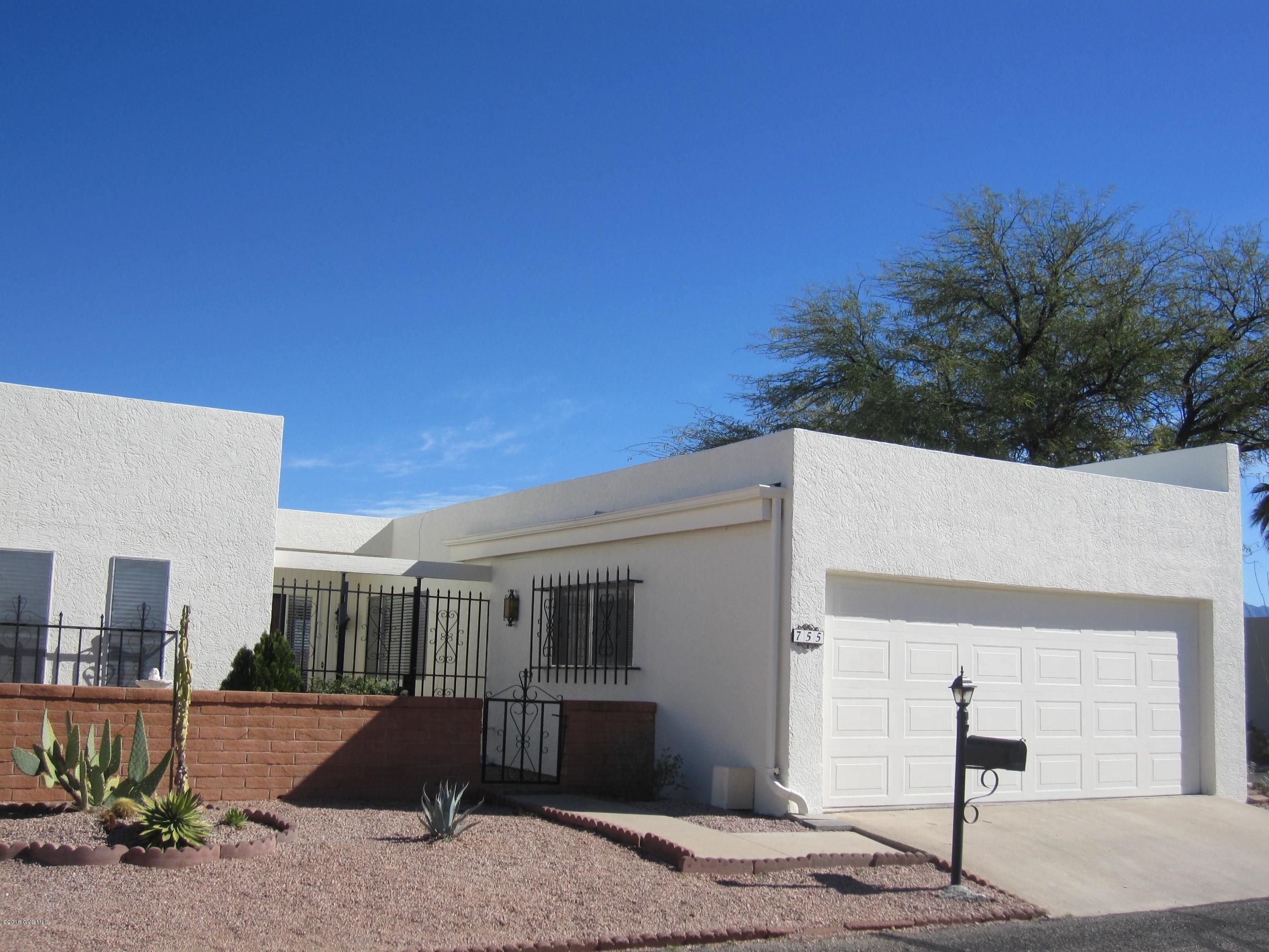 PANORAMIC VIEWS FROM THIS END-UNIT, CORNER LOT IN COVETED TOWNHOUSE 6! LOCATED IN THE CENTER OF TOWN CLOSE TO SHOPS, RESTAURANTS,AND ACTIVITIES! NEWLY STUCCOED AND FRESHLY PAINTED THROUGHOUT! GORGEOUS ARIZONA ROOM LEADS FROM THE GREATROOM THROUGH FRENCH DOORS. SPACIOUS, LIGHT-FILLED FAMILY ROOM/DEN OFF THE KITCHEN WITH A WET BAR CABINET. BRICK PAVER PATIO TO SIT ON AND ENJOY YOUR MORNING COFFEE. EVENING SUNSETS ARE DYNAMITE! 17 ACRES OF LUSH DESERT COMMON AREAS RUN THROUGHOUT THIS 90-HOME SUBDIVISION. GREENBELT RUNS BEHIND ALL TOWNHOMES. ROCKED WALKING TRAILS LEAD TO NEARBY GREEN VALLEY RECREATION POOL, SPA, AND REC ROOM. THIS HOME HAS BEEN PRE-INSPECTED AND IS READY FOR ITS NEW OWNERS! COME ENJOY RETIREMENT. SELLER IS OFFERING A 2-10 HOME WARRANTY PLAN!ROOF RECOATED-3/16.