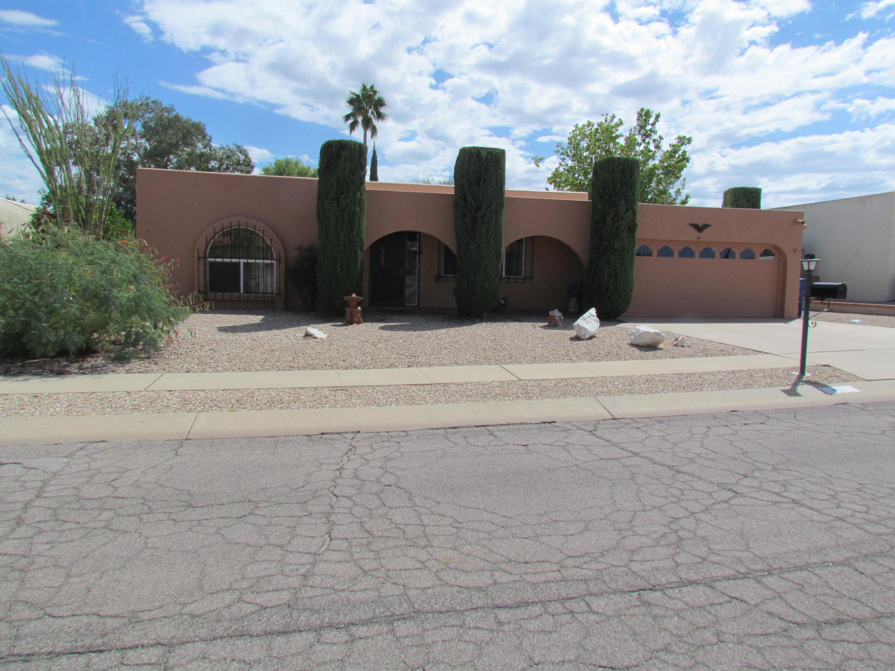 EXCEPTIONAL HOME/NEW HEAT PUMP 11/2O15/ROOF RE-COATED & OUTSIDE OF HOUSE PAINTED 5/2016/NEW WINDOWS/ NEW HOT WATER HEATER/TILE IN KITCHEN, LIVING AND DINING AREAS/GARAGE 19 1/2' X 25'/UPDATED KITCHEN/GLASS BACK SPLASH/SPACIOUS LAUNDRY ROOM WITH SPACE FOR OFFICE & HAS SEPARATE COOLING/LARGE BACKYARD WITH MT VIEWS,2 CEILING FANS, COVERED BLOCK PATIO & ALLEY ACCESS/FURNITURE INCLUDED IN SALE/THIS IS MUST SEE!!!!!