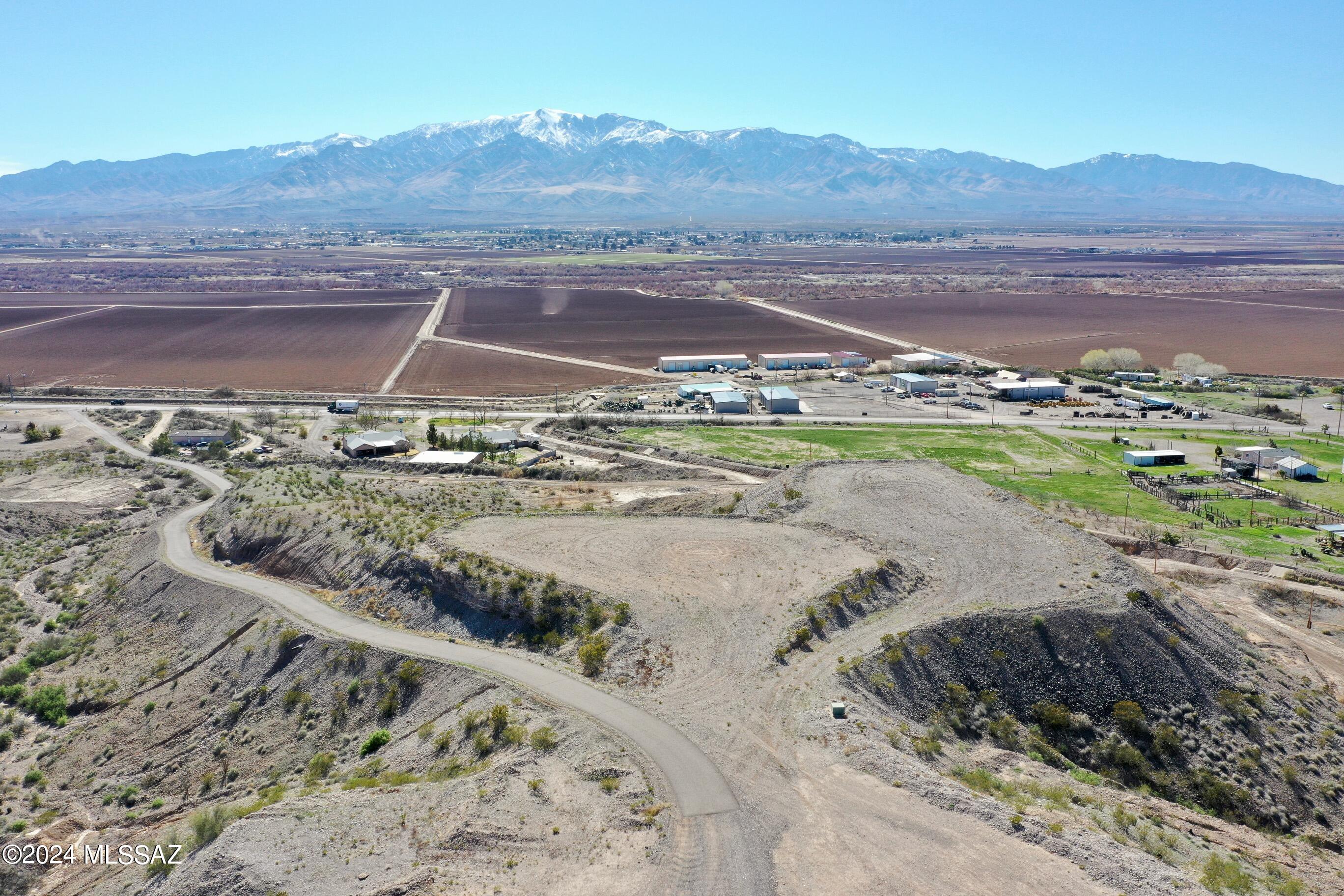 Welcome to your opportunity to own a slice of paradise in the picturesque city of Safford! This vacant lot boasts breathtaking panoramic views of the stunning cityscape and majestic mountains, offering a serene retreat from the hustle and bustle of everyday life.Spanning a generous 1 acre, this parcel provides ample space to bring your dream home to life amidst the tranquil surroundings. Whether you envision a sprawling estate or a cozy retreat, the possibilities are endless.Convenience meets comfort with electricity available near the lot, along with the added benefit of a shared well agreement, ensuring easy access to essential utilities. Buyer to verify the cost and availability of utilities and water well capability. A survey on file provides peace of mind, offering clarity on boundaries and layout. Immerse yourself in the tranquility and beauty of this prime location, where peace and quiet abound, and natural wonders are just outside your doorstep. Don't miss out on this incredible opportunity. Call and schedule your appointment to view this property today!