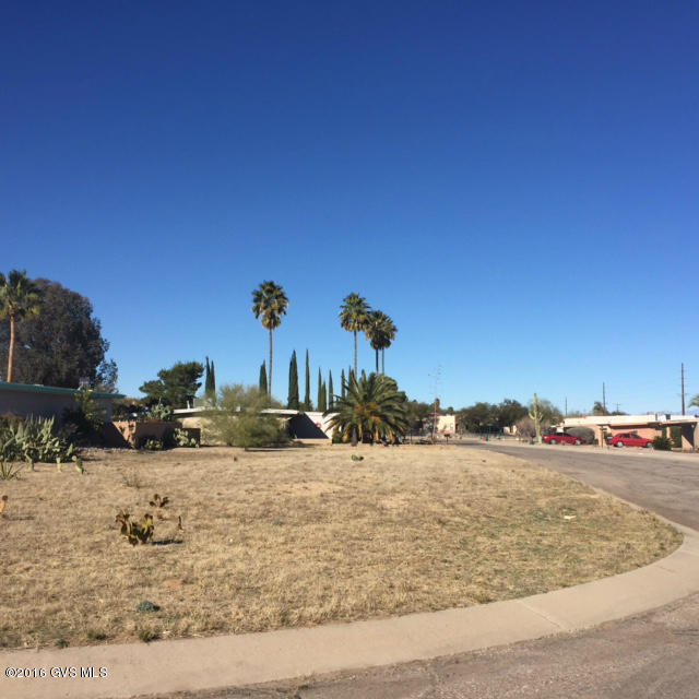 Very level corner lot to an entrance of a cul-de-sac in a centrally located neighborhood with mature vegetation. Age restricted area with club house, rec center, tennis courts and walking path. Green Valley Recreation membership is optional.