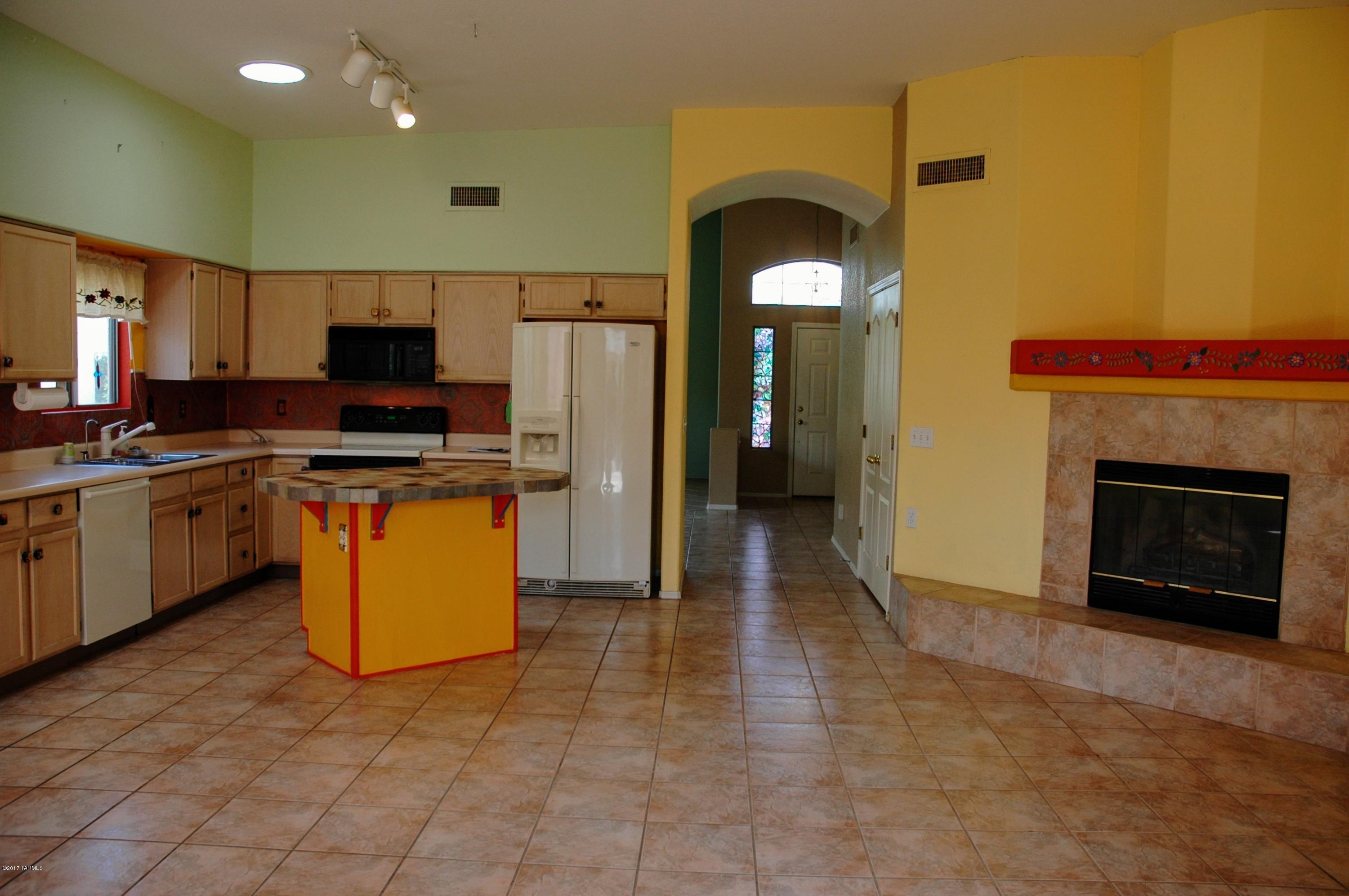 Great location and low HOA ($4.50) fees. Tasteful color in each room shows an eye for detail.  Back yard is an oasis with citrus, roses, native desert plants and a wall that is high enough to provide privacy without feeling confining. Three bedrooms and 2 bathrooms, nestled in the heart of the community.  Well-cared for house is an easy move-in.