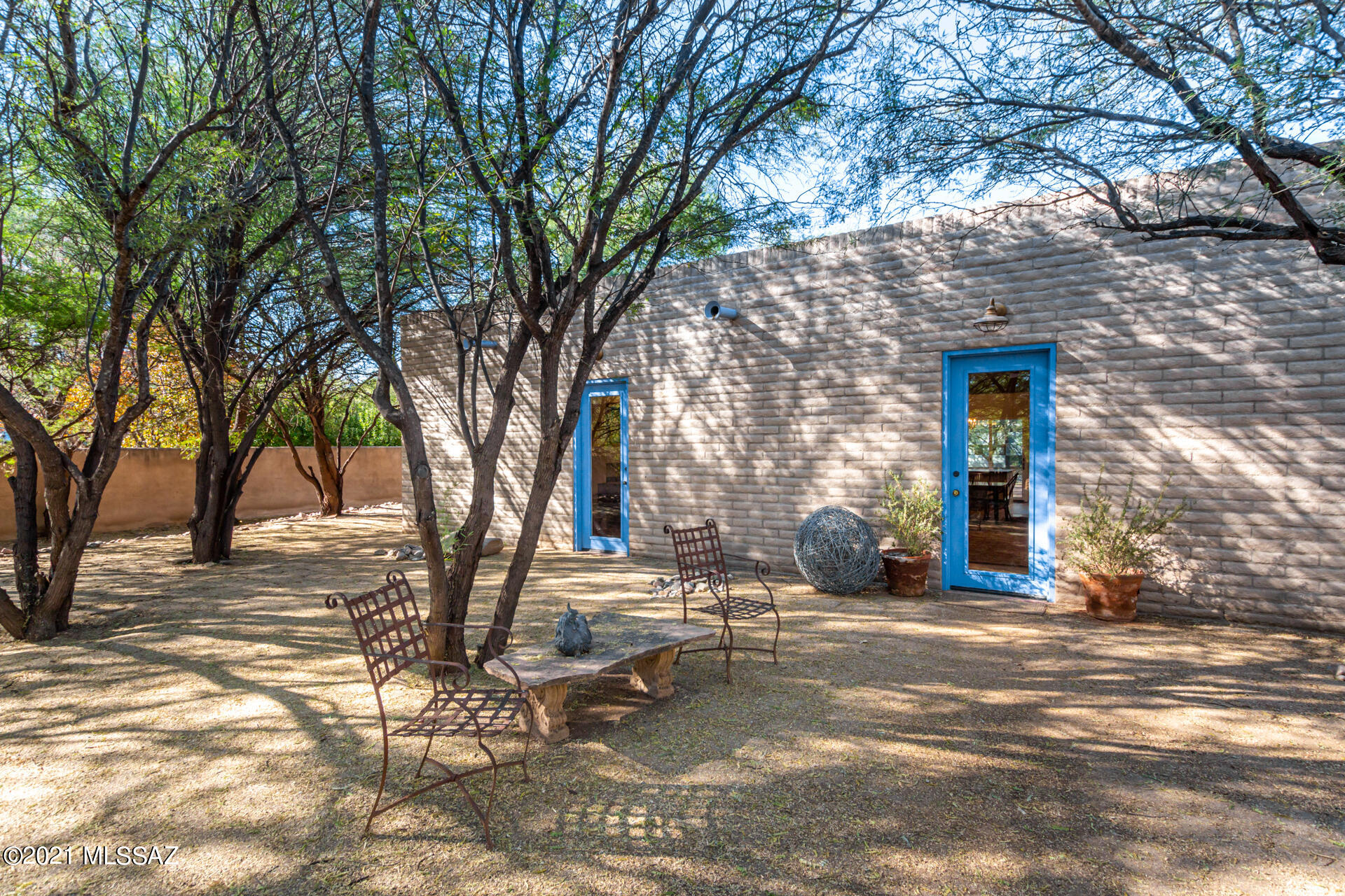 Beautifully remodeled burnt adobe brick home in the heart of Tubac! With over 3000 square feet with 2 bedrooms, two bathrooms plus a studio, this magnificent home is on a quiet street but close to everything that Tubac has to offer!   As you enter the home you're greeted by a Stunning great room with high ceilings and lots of natural light with fireplace. The great room opens up to a completely remodeled and expansive kitchen with new stainless steel appliances and has one entire wall of windows looking out into the back courtyard and mature mesquite trees.  The owners suite and bath is expansive and also has been remodeled to take advantage of natural light and to afford access to the back patio which is heavily treed and shaded. In addition to a guest bedroom, this home has a studio area which is perfect for an art studio, exercise room or office.   Very few homes in the village of Tubac become available and even fewer that have been tastefully remodeled and expanded. This is an offer you won't want to miss!