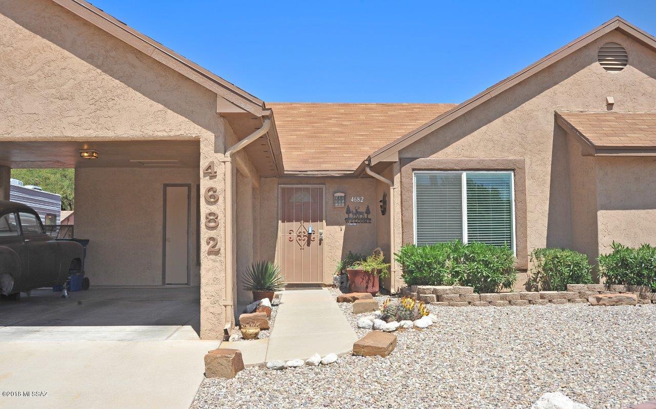 Upgraded, updated 3 or 4 BR - ceramic tile in kit., baths and SOLID BAMBOO flooring everywhere else. Ceiling fans w/light kits, custom colors. Kit.w/ knotty Alder custom cabinets, glass tile back splash, solid surface counters, newer appliances incl. Bosch DW, newer stove, microwave. Large pantry! Updated master bath w/new vanity, lighting, plumbing fixtures, newer toilet and gorgeous tile surrounds. Vaulted ceilings in living/dining area and wood burning F'PL w/black walnut mantle. Formal dining OR den or 4th BR! Fam. rm w/ room for pool table & more - separately heated and cooled. NEW dual pane windows! Yard is an oasis with Koi pond, RV space (can fit 30'), storage sheds, block wall, dbl gate to yard, covered patio, extended decking, mountain views. Great location!