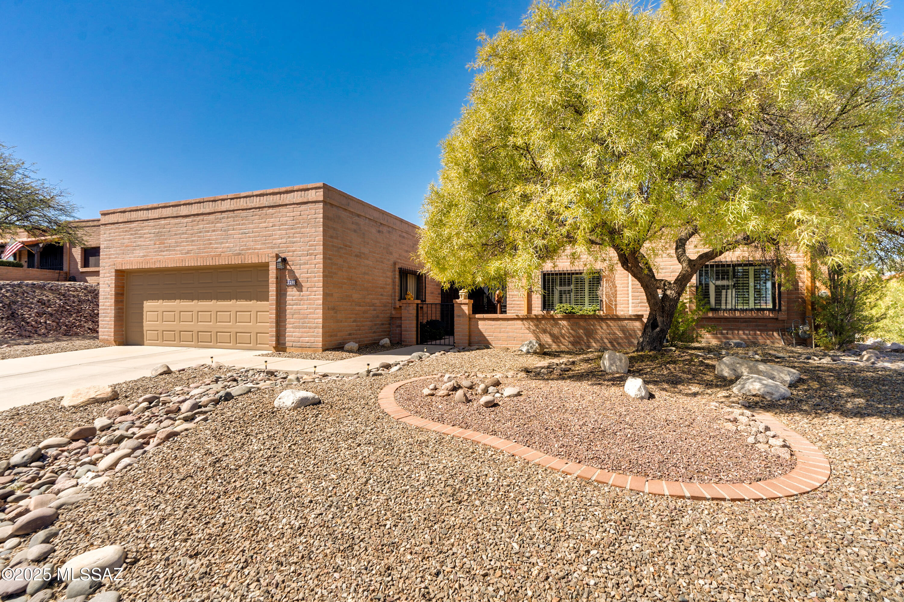Multiple views and a luxurious en-suite primary bathroom! If living in a well regarded development sounds appealing, then put this opportunity in Canoa Estates at the top of your Green Valley tour list. This appealing 2-bedroom, 2-bathroom Territorial home offers an array of advantages. The property is an easy pedestrian distance to Canoa Hills Trail Park. Enjoy amazing views of Madera Canyon, the greenbelt, and Canoa Hills Trail Park. Cross the threshold into a warm welcome that includes a splendid entryway, natural lighting, neutral decor, and a gas fireplace in the living room. The ample, well-designed kitchen is gorgeous with natural light, fresh updates, premium appliances (GE Cafe), dekton counters, and ample pantry space.  The wrap around enclosed patio creates a perfect environment for relaxing and entertaining. The recently added patio offer stunning mountain views. The garage and front enclosed patio have been given a fresh coat of epoxy for easy care cleaning. The home boasts a very large Den/Office. Also note the updated Blinds and plantation shutters. This is a must see .