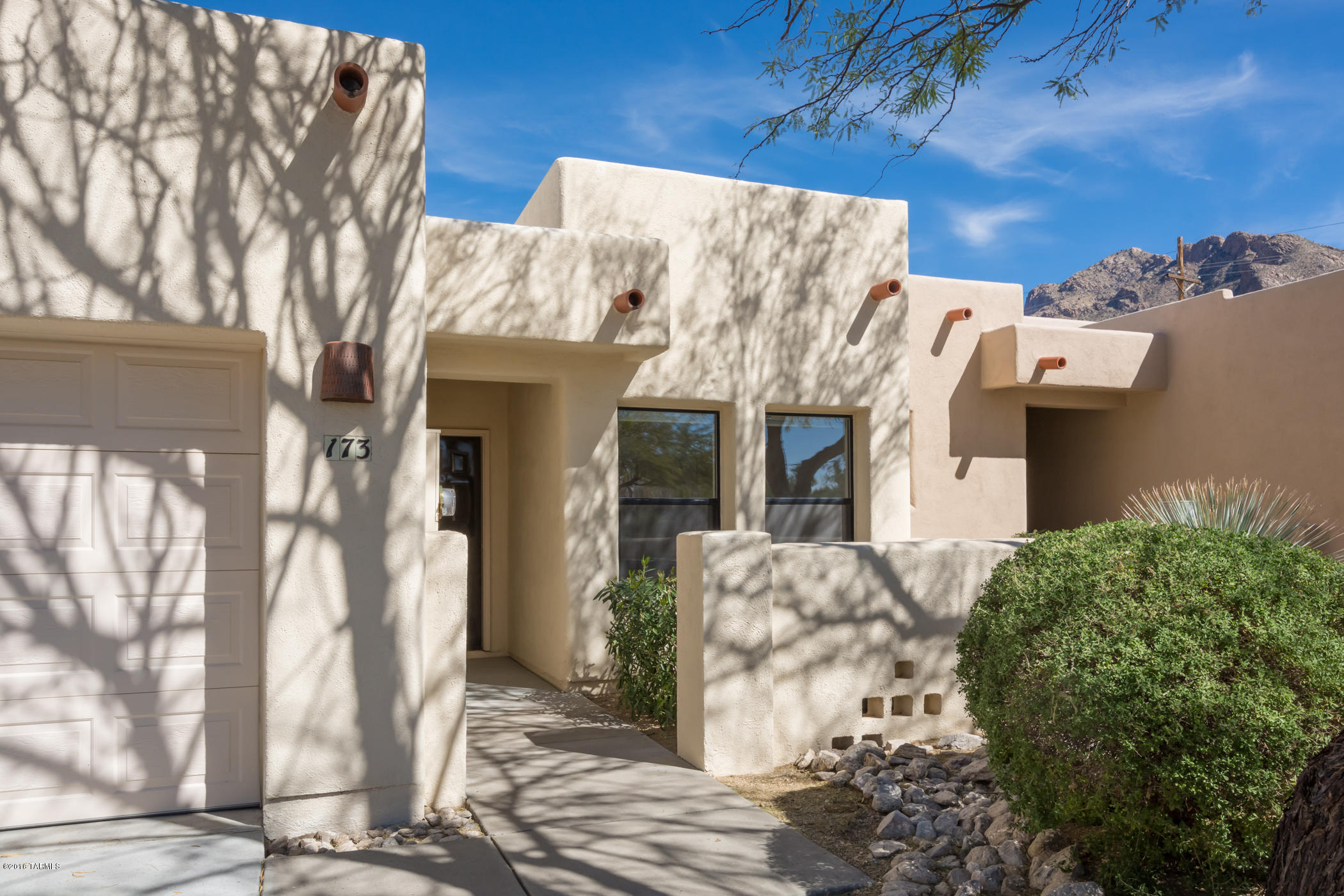 Absolutely one of the best lots in the subdivision has stunning mountain views from the backyard! This never before offered home designed by well known architect Ron Robinette features sky high ceilings and clerestory windows that bring in tons of natural light. Spacious greatroom with fireplace.  Lovely kitchen with Corian counters and black appliances.  Large, blocked walled backyard with covered patio.  New A/C unit installed 2013.  Terrific community pool area.