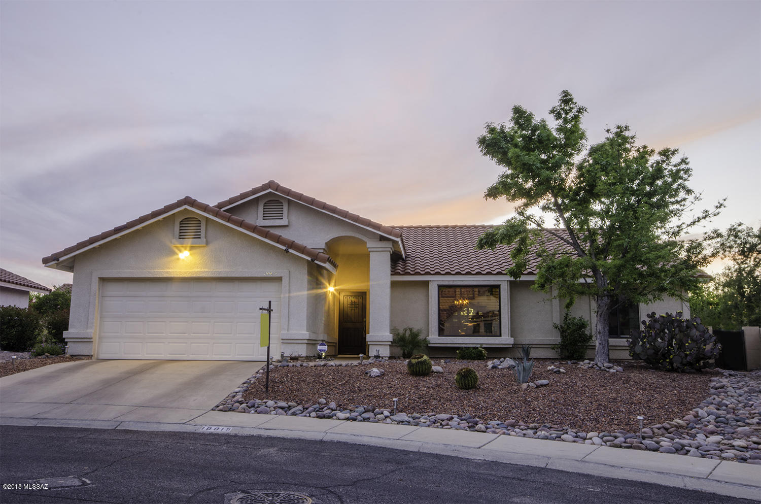 Bright and open, this home is ready for you to call home. Custom front door welcomes you into the great room with high, vaulted ceilings (and the wall-mounted flat screen TV is
included!). The remodeled kitchen with granite counters and stainless steel appliances are a cooks delight. The french doors lead out into a garden-like backyard with amazing
mountain views, flagstone patio and a relaxing hot tub. Back inside, the master suite has a bay window, dual sinks, separate garden tub and shower. Oh, and yes, the house has been
re-plumbed and has no polybutelene.  Please note, due to seller's dogs, they have removed carpeting and painted the concrete, buyer will need to re-seal or install carpet. Due to this, and at this price, seller will not consider FHA or VA offers at this time.
