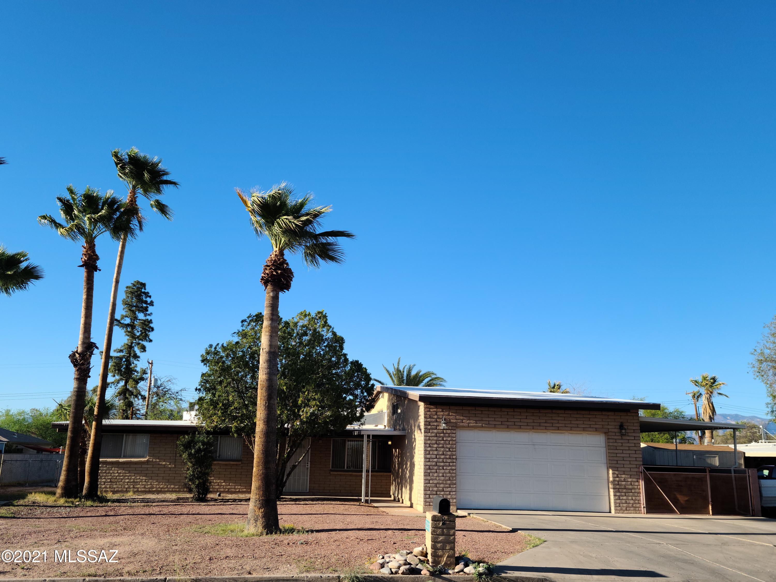This property offers so much, truly a must see! Central location, easy access to all areas of town. No HOA. Well cared for 3 Bedroom 2 Bathroom 1706 sqft home, features large open floorplan. Cold A/C. 2 car garage plus a 2 car gated carport. .37 acre lot. Extra large backyard has a blocked wall and an additional structure which could be used as a workshop or to store an RV/Boat/cars, gate to backyard! Hurry, this home will sell quickly!