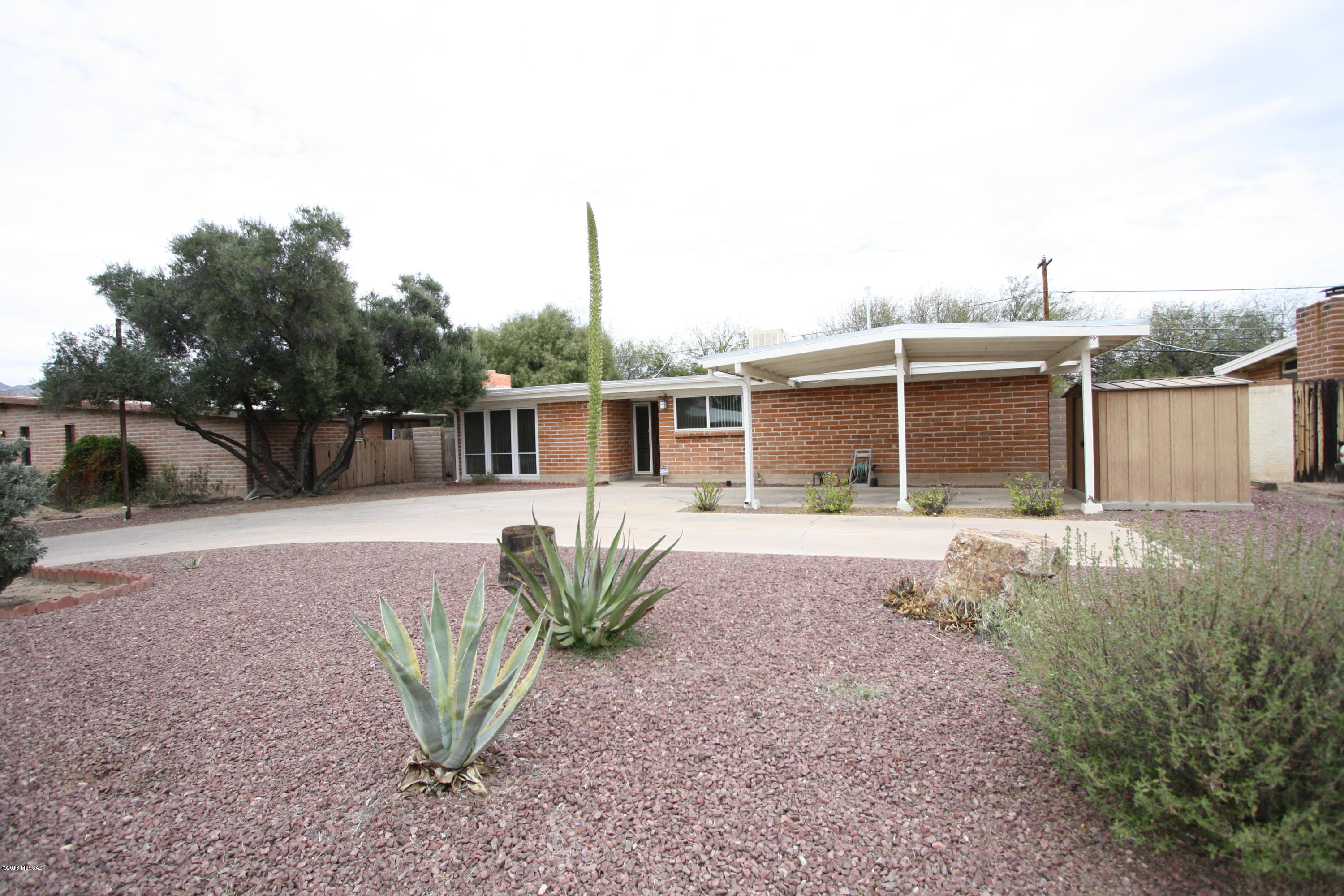 When summer arrives, beat the Heat by Splashing into your own PRIVATE Pool! Spacious Three Bedroom, with Extra Room for Den/Family Room Off Remodeled Kitchen. Great Central Location Near TMC. Call Office to View. *owner is leaving large shed for tenants use, however there is a smaller shed that tenants will not have access to.