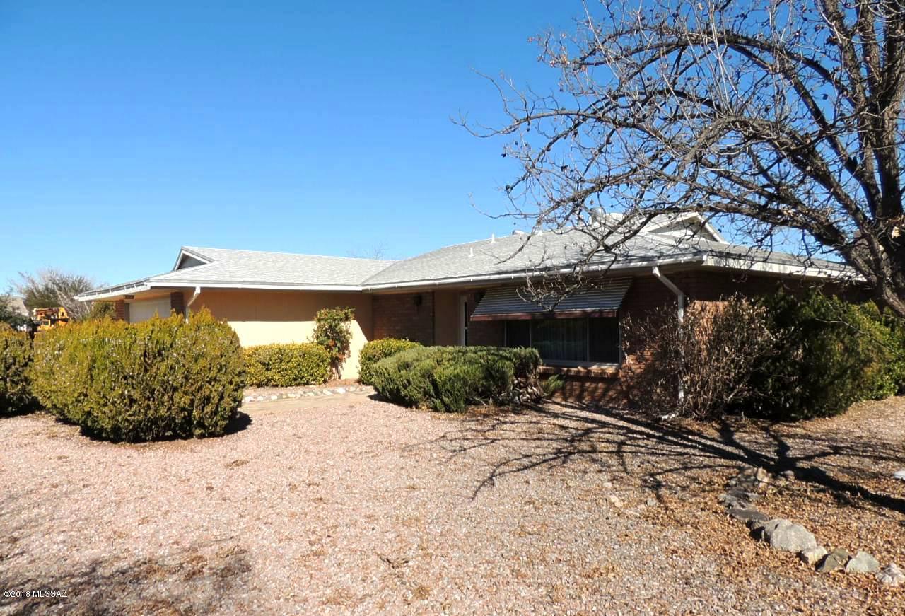 ONE OWNER HOME with a serious Retro Vibe! The Seller had this custom home built by Horizon in 1971!  A brick home on a large corner lot (0.32 ACRE). Chain link fence in the low-care backyard. Updated double pane vinyl windows throughout. New hot water tank in 2013 & newer gas furnace. The roof was replaced within the last couple years but the Seller is not certain of the year.  Large bedrooms are light and airy with ceiling fans.  The property features three bedrooms, two baths, dining area off the kitchen, family room with wood fireplace and covered back porch. The carpet needs to be replaced & some paint but you can tell this home was lovingly cared for!  Get out of the city and come enjoy the quiet life in the county!  Only an hour from Tucson!