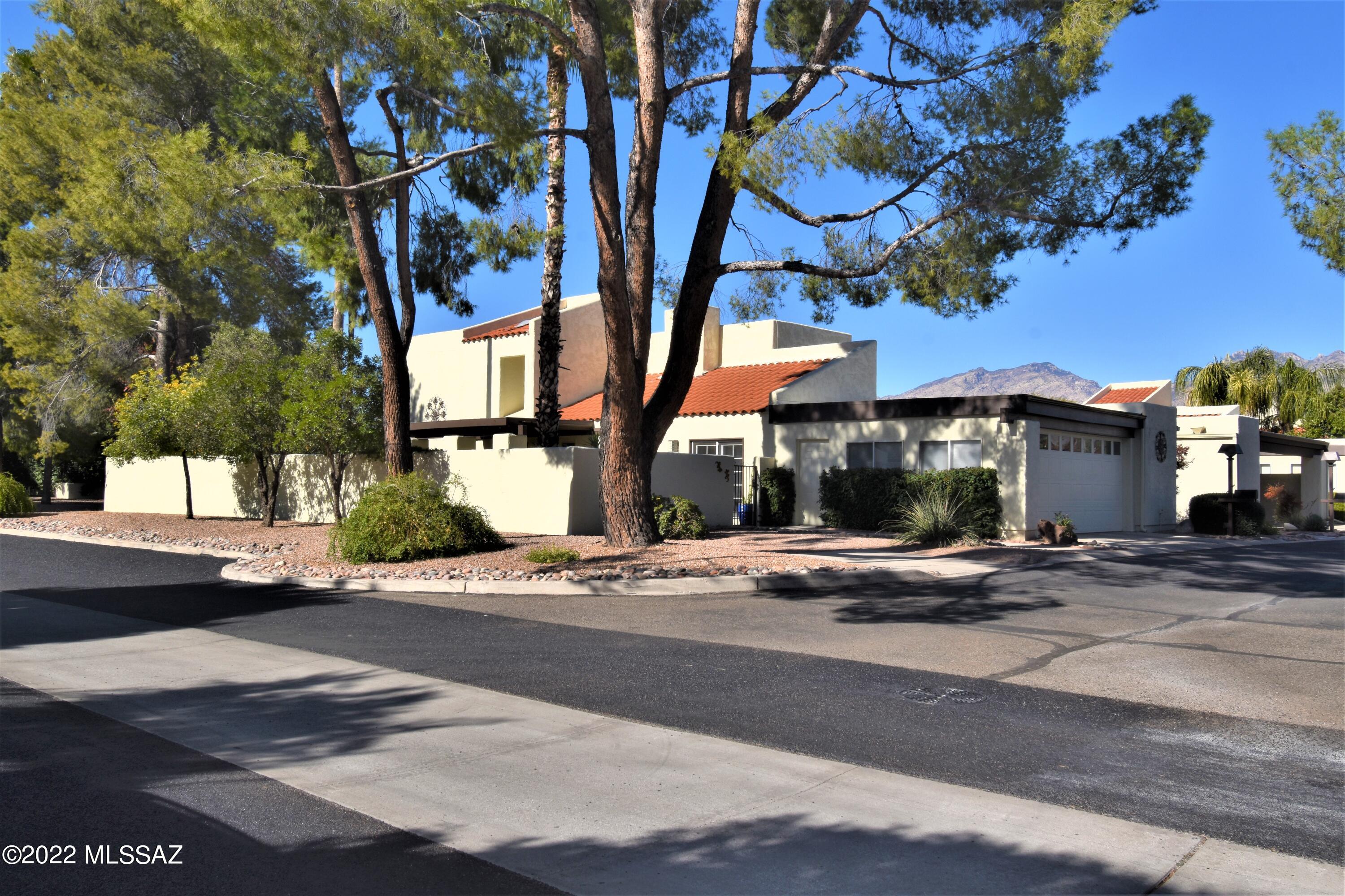 Gorgeous 4-beds, 3-baths with 2,307sqft & located in the sought-after community of Villa Del Rio. Foyer leads to a stunning living room with wood beam ceilings & an impressive see thru fireplace. Kitchen is beautifully designed with an abundance of cabinets, generous amounts of granite & a spacious breakfast bar. Primary is inviting & boasts a private balcony with mountain views, large walk-in closet, & dual sinks. Upgrades include NEW ROOF W/ 5YR WARRANTY, NEW carpeting, NEW faucets/fixtures, interior/exterior paint, NEW stove, & more! Huge yard is ideal for entertaining with 2 patios & perfect for al fresco dining. Attached garage is a great size & has a big storage room. Plus, a private guest parking pad.  Community includes heated pool/spa, tennis & lush landscaping. This is a free-standing townhouse which means it's not attached to your neighbor's house.