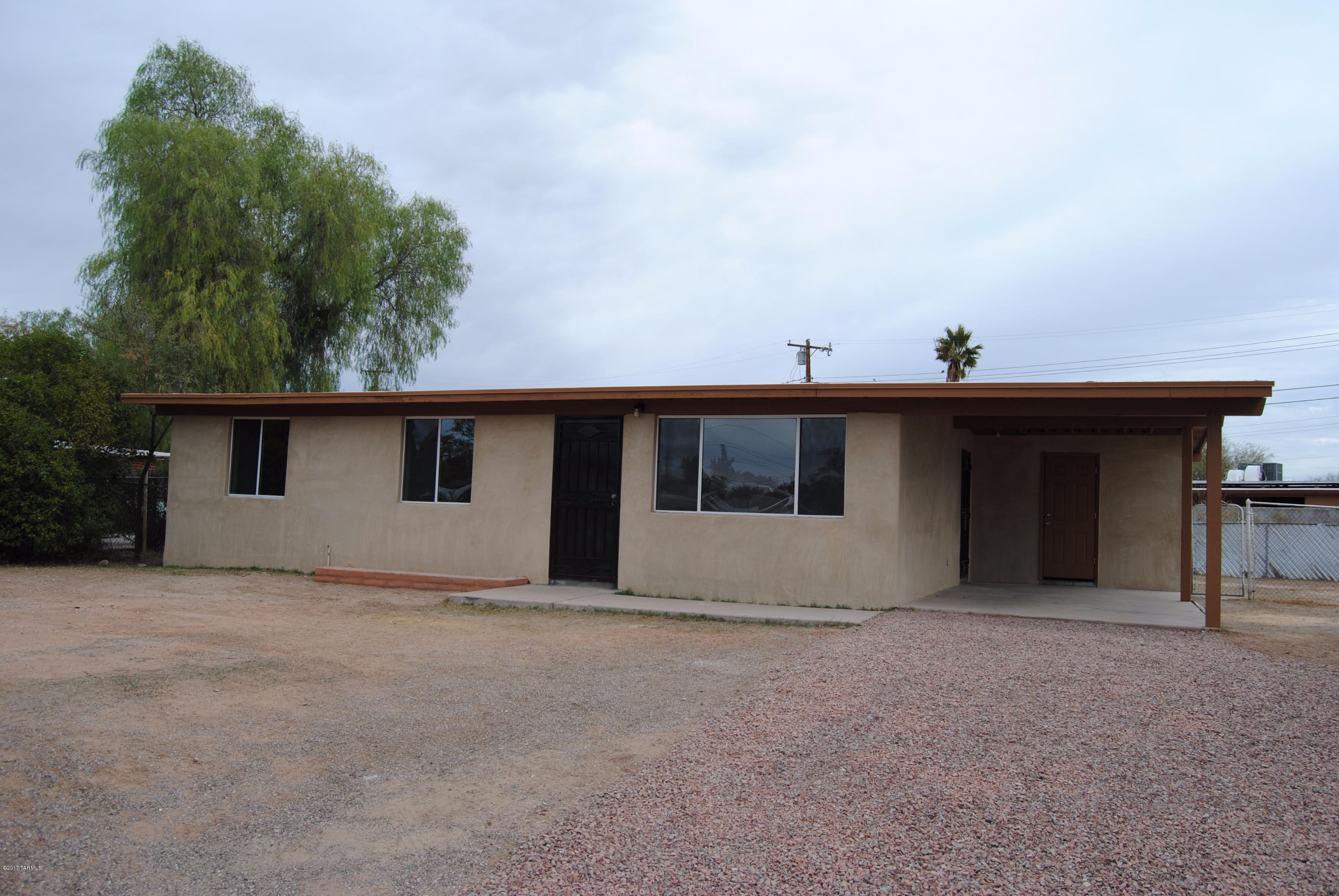 Beautifully remodeled, completely repainted inside and out, and has all new flooring, updated kitchen, wonderful custom tile work in both bathrooms, and more! All new sheet rock instead of painted brick gives this home a modern style! Great starter home with a huge backyard on a large lot!