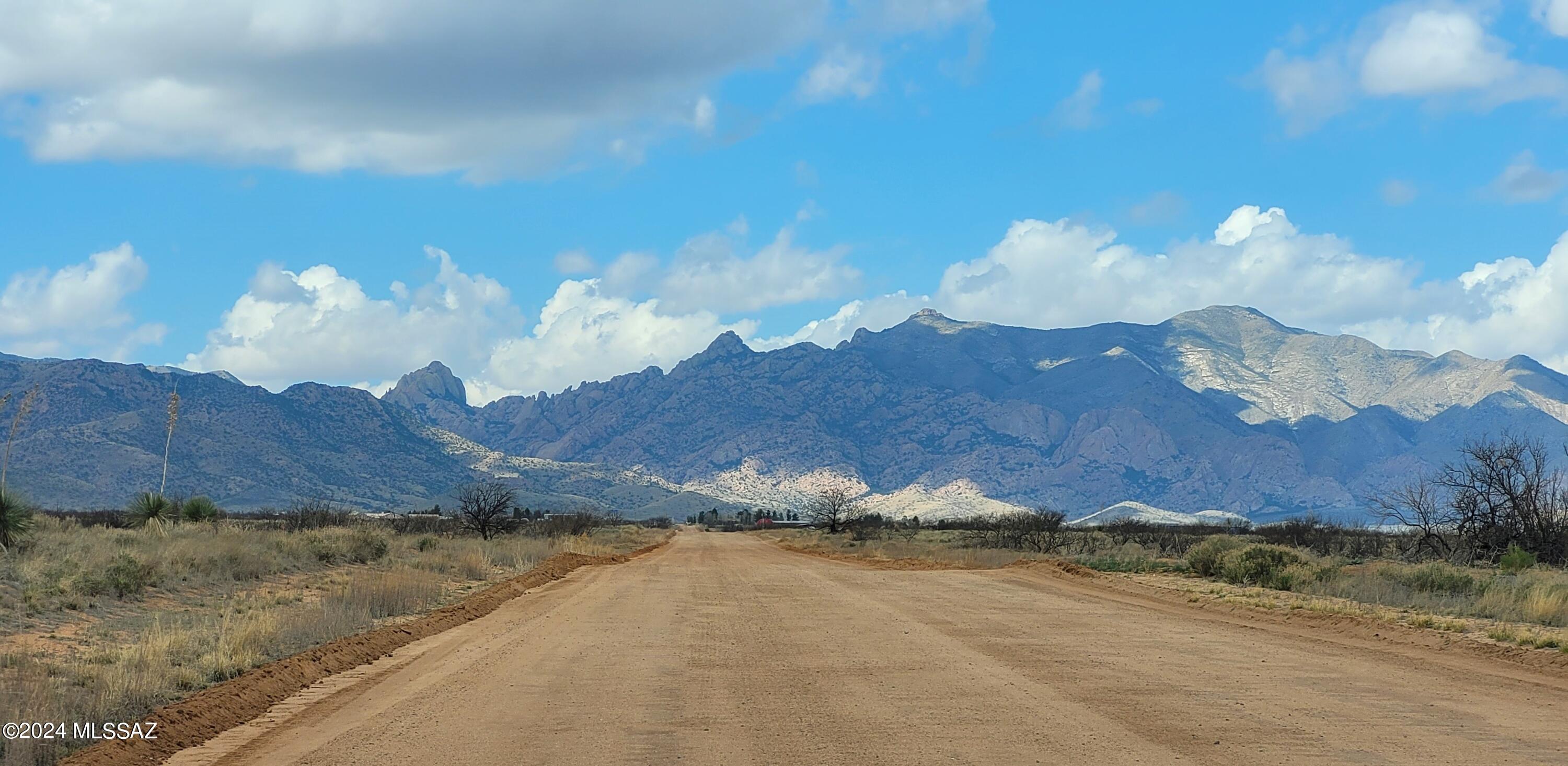 Corner Lot on a county maintained road.  1.70 AC (two tax parcels) located less than a 1/2 from Sunsites.  Super easy access on a 50' wide dirt road.  All level and usable.  It's a great price considering the location and views.  The south side This lot is located in Unit 4 which is desirable for its westerly views of Cochise Stronghold; the Dragoon Mtns and easterly views of the Chiricahua Mtns in the distance. It is a little cooler at 4200' elevation - located in the high desert grasslands with an abundance of wildlife and birds; natural cacti and a few spotted mesquites. Only 2 minutes to the Village of Sunsites, and about an hour to Tucson.  Buy as an investment or develop into a great home site!  Listing agent is related to the seller. The seller is a licensed real estate agent in AZ The south side is the best because there will be less dust.  We have SE prevailing winds.