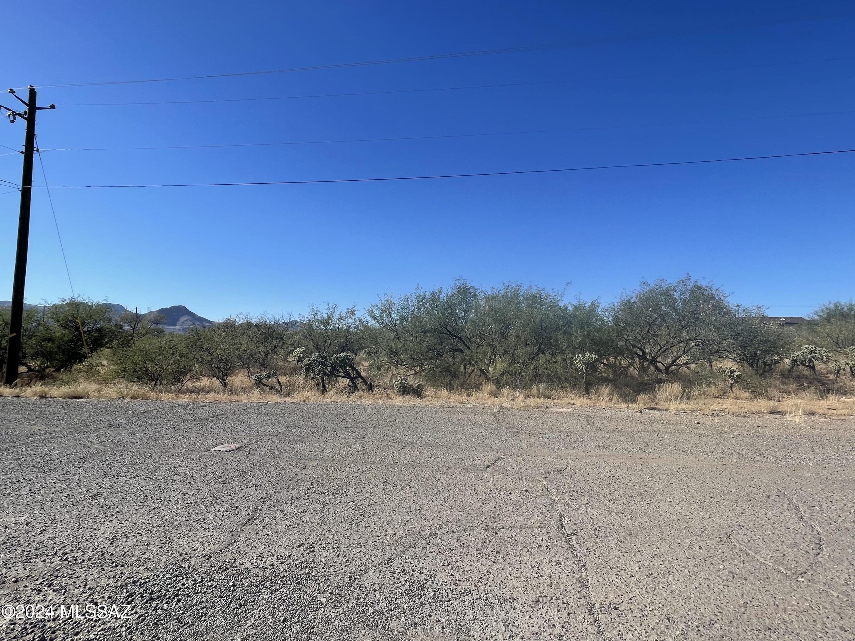 Build your home on this .23-acre lot surrounded by great views of the surrounding mountains. It is a flat lot on a paved road. Electricity poles and water are nearby. Just minutes away from shopping and restaurants. Easy access to the freeway.