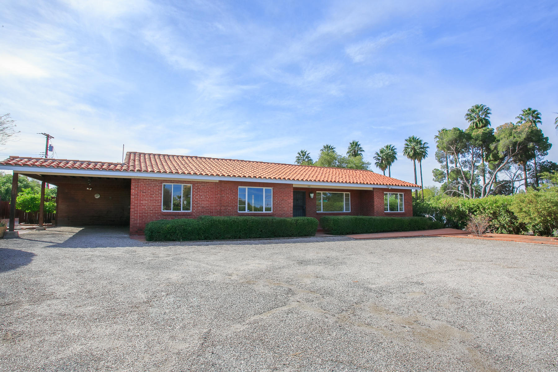 Vintage home in Catalina Vista on expansive and very private corner lot. Many north facing windows offer mountain views and ample natural light. Hardwood floors throughout most of this home add to the historic charm, as well as crystal lighting and colorful tile. Large rooms and gracious floor plan. Wonderful opportunity to enjoy a classic Tucson treasure in one of the city’s most convenient neighborhoods.