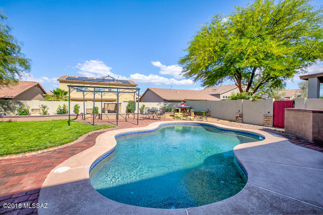Spacious, 4 Bedroom, 2.5 Bath home for rent with a 3-car Garage & Pool in prestigious Presidio Monterey, close to all the amenities of Rancho Sahuarita. Open floor plan & soaring ceilings! Formal living & dining rooms. Large Kitchen with Granite counters, Stainless Steel appliances, Lots of cabinets & an eating area that is next to the inviting family room. Half Bath on the first floor. HUGE Master Suite on the second floor, convenient to the 3 other bedrooms upstairs. Master Bath features a huge vanity with dual sinks, soaker tub, separate shower, large walk-in closet and a private commode room. Hall Bath, with a tub/shower is located between the 3 other bedrooms. Relax in the POOL in the beautifully landscaped backyard with an extended patio, Gas Fireplace & BBQ area.