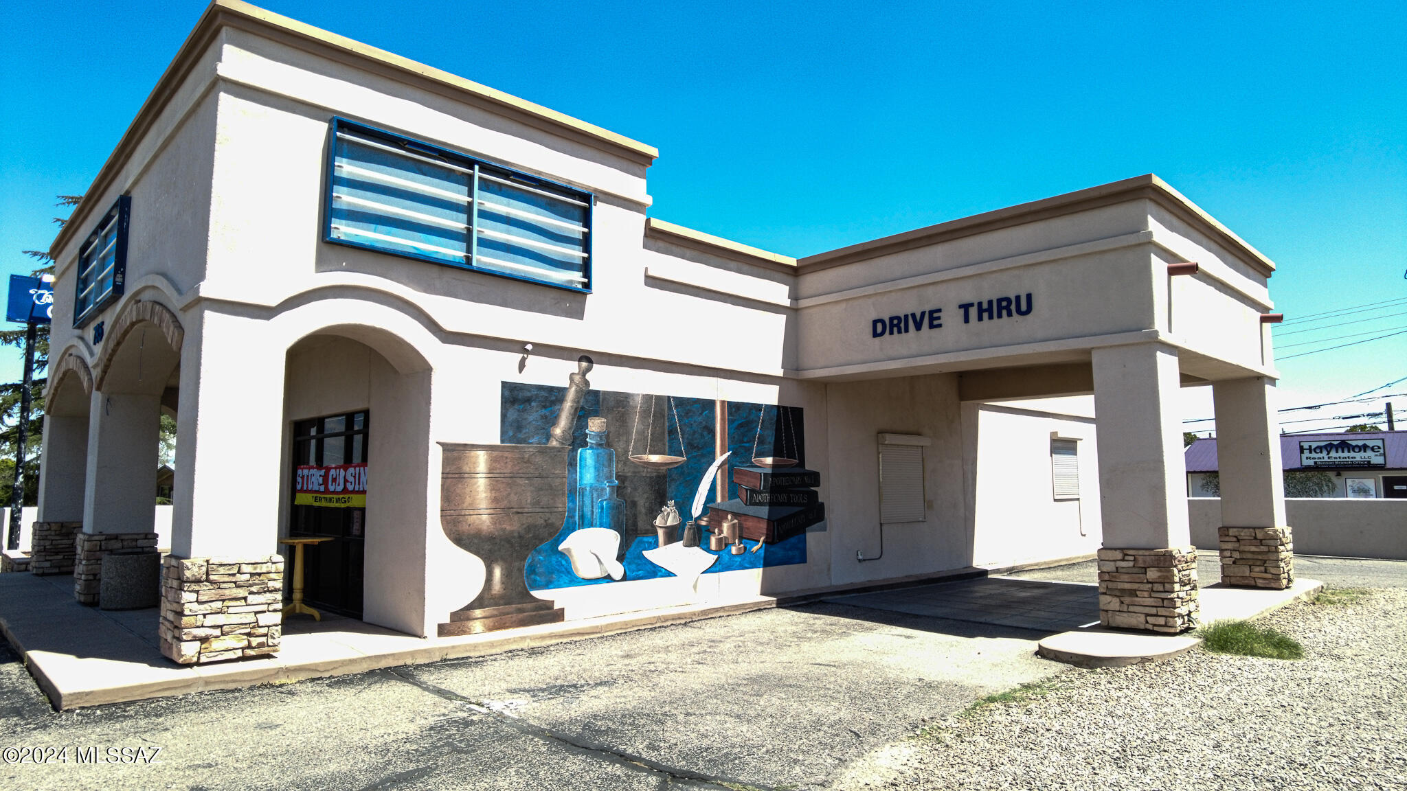 PRICE REDUCED!! Prime Business Location!  1,972 sq. ft. building, was previously a pharmacy.  Includes Drive Through, security shutters, security cameras, paved parking lot., wide hallways and wide doorways, ADA compliant bathroom. All this and more on corner lot with frontage to high traffic street. Building can be a Pharmacy again after June 2025, but the possibilities for another business are limitless.