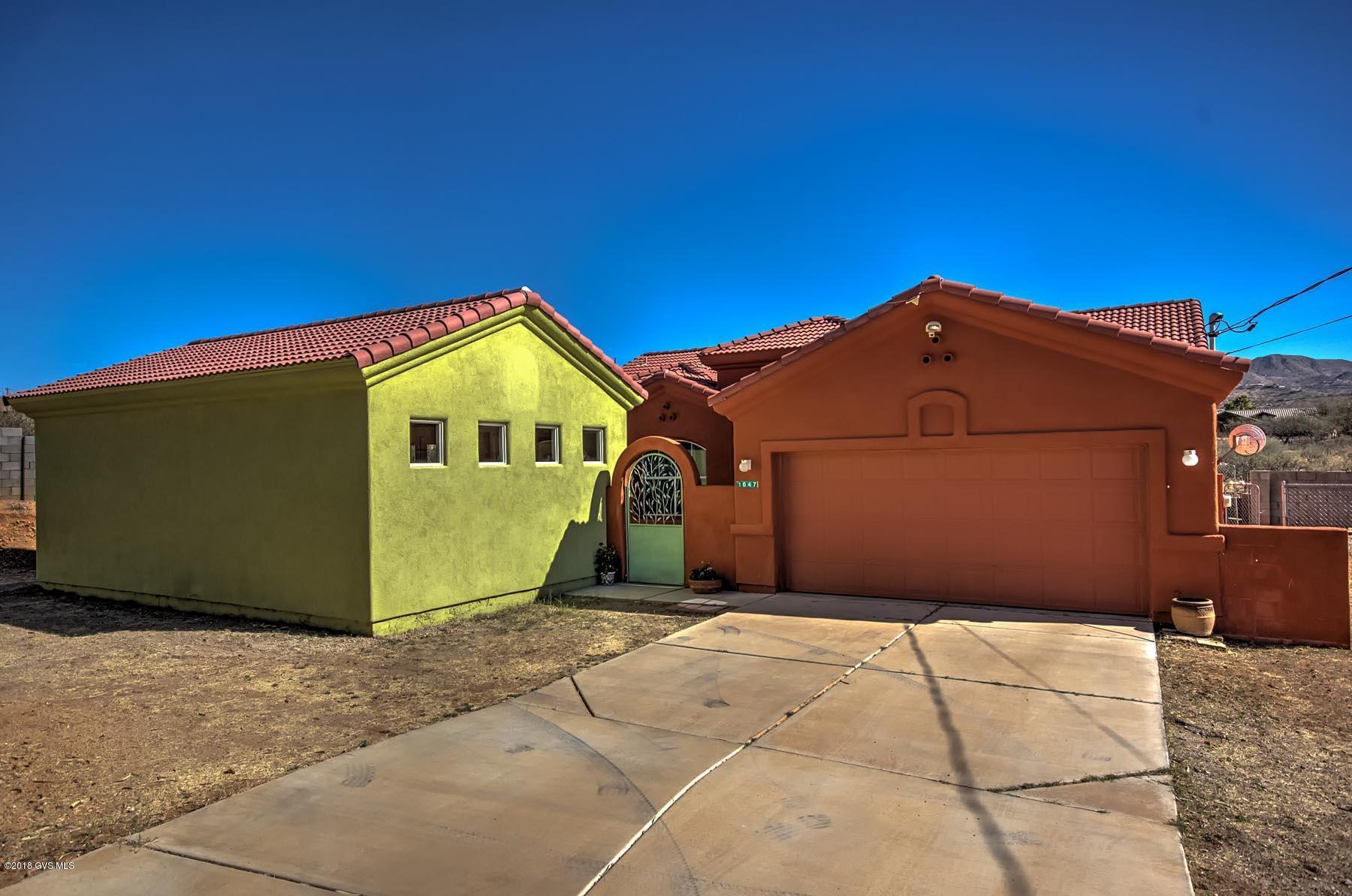 Great location in NE Rio Rico ! This home offers 1970 sq ft of living space including 3 bedrooms, 2 baths, large eat in kitchen, tile flooring and has lots of light. There is a fenced yard with dog run and a separate 508 sq ft workshop with HVAC and 200W outlet for welding. Beautiful mountain views. Priced to sell!