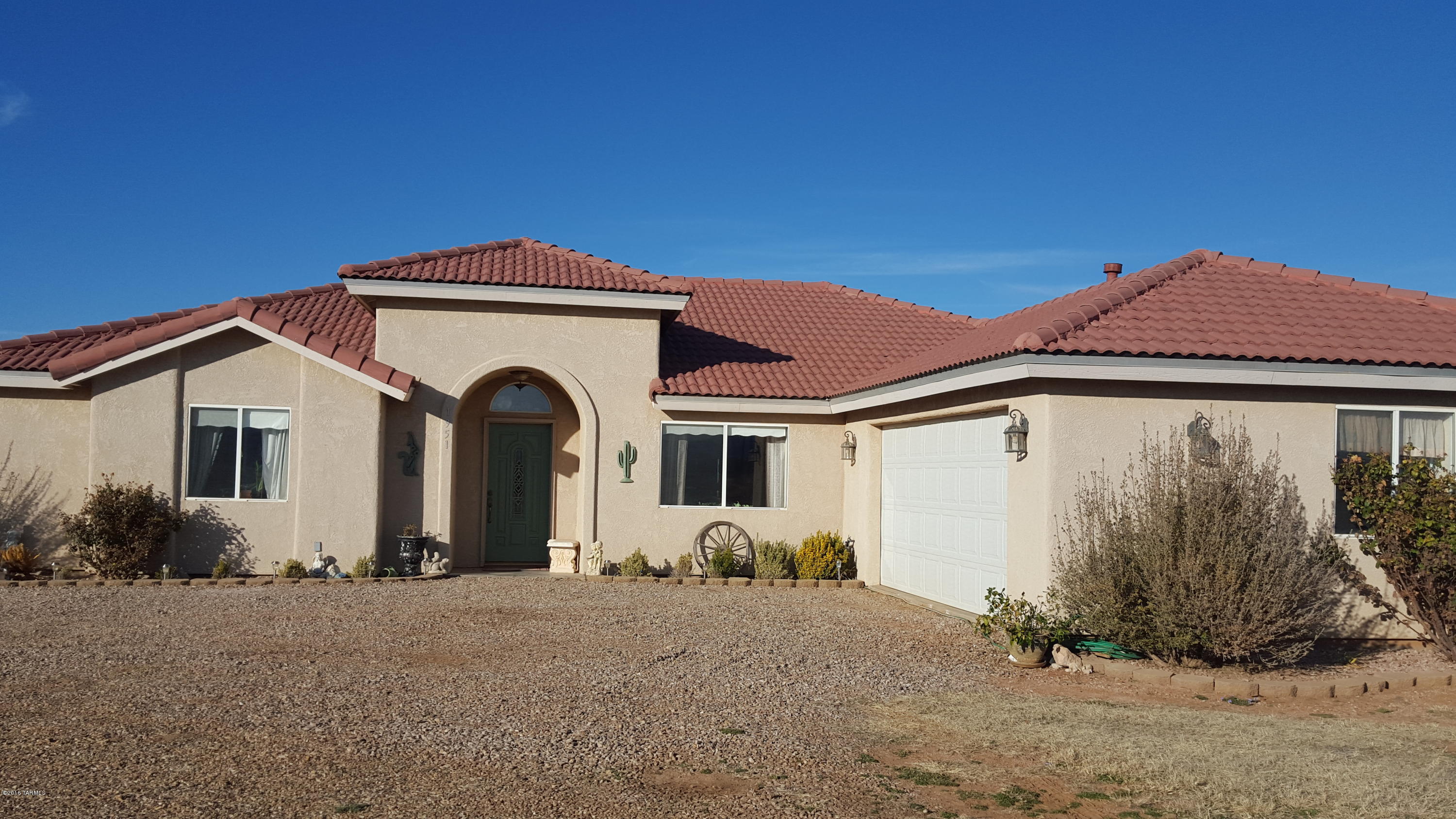 360 DEGREE MOUNTAIN VIEWS. Gorgeous 1795 sq ft custom home on 36.99 ac. w/ a 100X200 arena, 50' round pen, 3 covered horse pens, permitted 20X30 tack/hay barn. Home ext. walls 2X6 construction. Property immediately surrounding home & arena fully fenced. Private registered well. Ceiling fans in all bedrooms & living room. Most appliances convey (see detail). Wheelchair accessible shower in extra large guest bath. Entire home was built w/ extra wide doorways. Double doors out of living room & master bedroom open to back porch. 4 Bd. 1 3/4 ba. Master bath has jetted garden tub & separate shower & dual vanity w/ granite tile countertops. Real Alder wood custom cabinetry throughout the home. Kitchen features: granite tiled countertops, dual fuel oven/range, micro-hood, deep dual stainless sink. Fireplace in living room. This home is beautiful. Don't pass this one up!