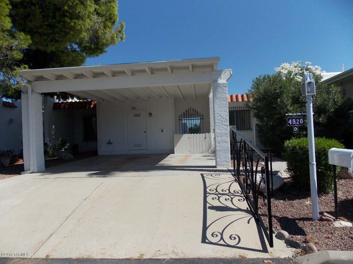 Centrally located townhouse in the Historic Fort Lowell District. Move-in ready. Freshly painted, popcorn ceiling removed, beehive fireplace, new carpet. Two master bedrooms each with own baths, eat-in kitchen, living and dining rooms.  Care-free yard with four storage rooms and mature fruit trees.  Enjoy the sparkling community pool and covered ramada. Convenient to stores, restaurants and movie theatre. Must be owner occupied.