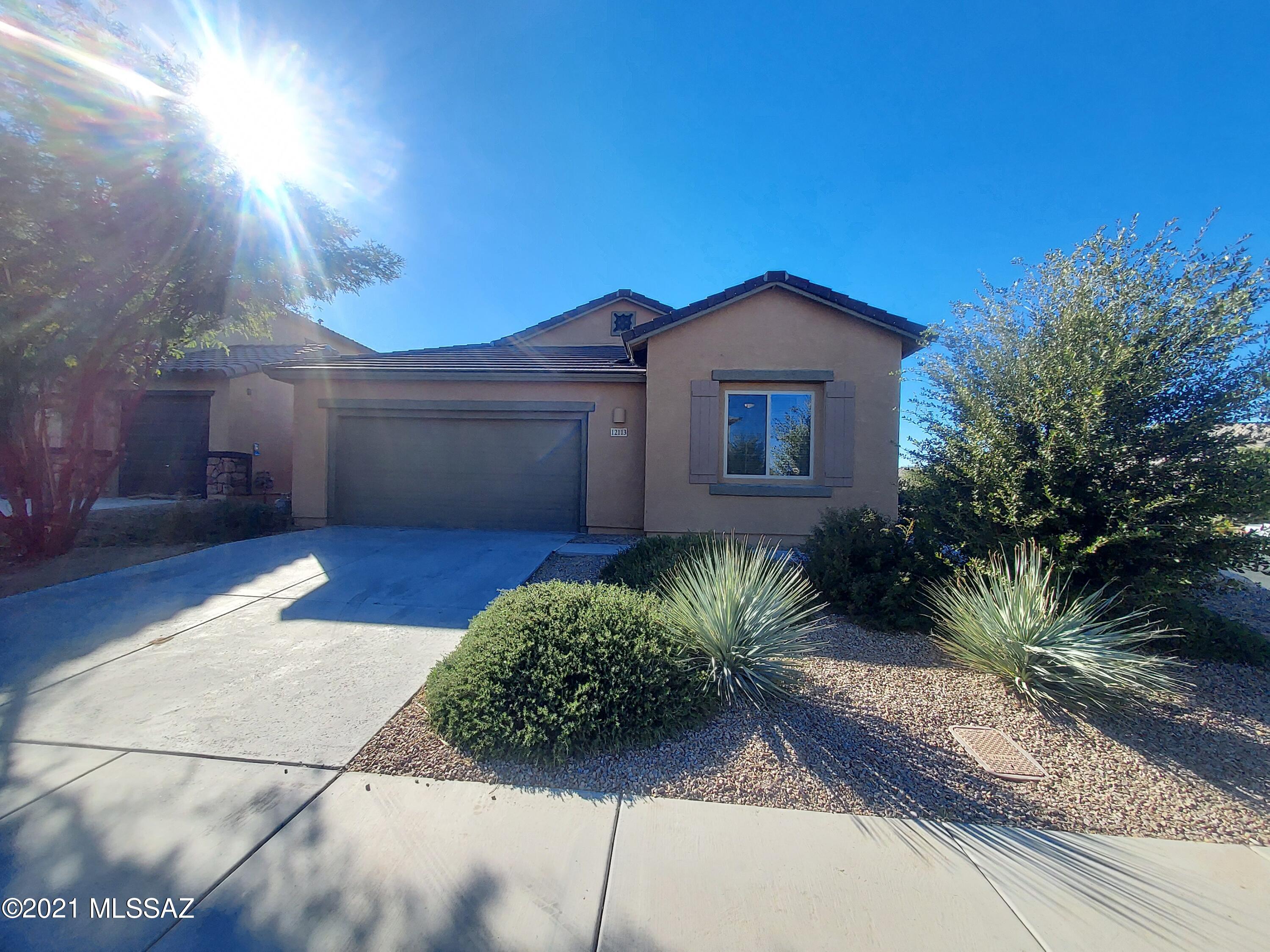 Beautiful 3 bedroom home in master planned community with easy access to I-10.  Kitchen boasts large island, upgraded cabinets, walk-in pantry, double ovens and gas cooktop.  Ceiling fans throughout, original handcrafted stained glass in dining area windows, master bath offers walk-in shower with dual showerheads.  On corner lot with landscaped backyard.
