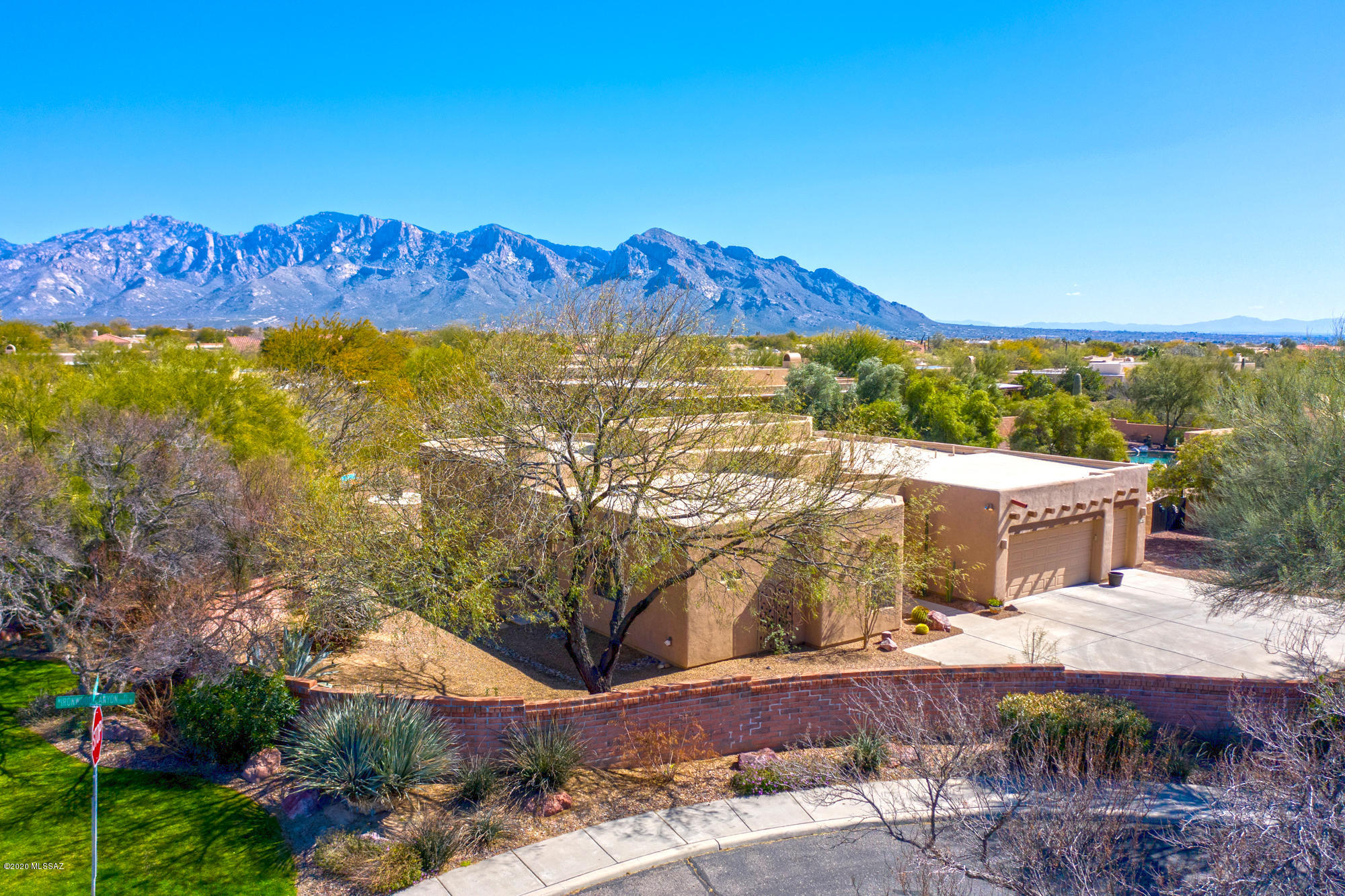 Spectacular views await at this 2570 sf single level home. Large open floor plan, with high ceilings welcomes you into the well appointed kitchen, large island with custom granite gives room for entertaining. Back yard has stunning Catalina mountain views, and lots of privacy. Sparkling pool has recently had surrounding area expanded at patio, for more room to enjoy the yard. Gated community near shopping, schools and more! Private, quiet, and with a great 3 car garage and plenty of other parking space. Call today to set an appointment to view this beautiful home!