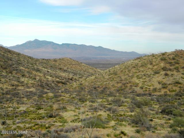 Views! Views! Views! Beautiful panoramic views and wildlife abound from this lot! Lush 10 acres that borders state land and has a ton of privacy. Fencing on two sides of this dividable lot. You will love the sparkling Tucson city lights in the distance. Rolling hills & mountains all around! Great paved street that leads you almost all the way up to the lot with just a short dirt road to get to your new home location. Very easy access to I-10, Raytheon, and much more. Come out and fall in love with this private land! SELLER FINANCING AVAILABLE!! OneAZ Credit Union does vacant land loans! Contact Chris Hubbard for more details at CHubbard@oneazcu.com | Office: 520-784-5047 | Cell: 520-560-6240 **See Documents Tab**