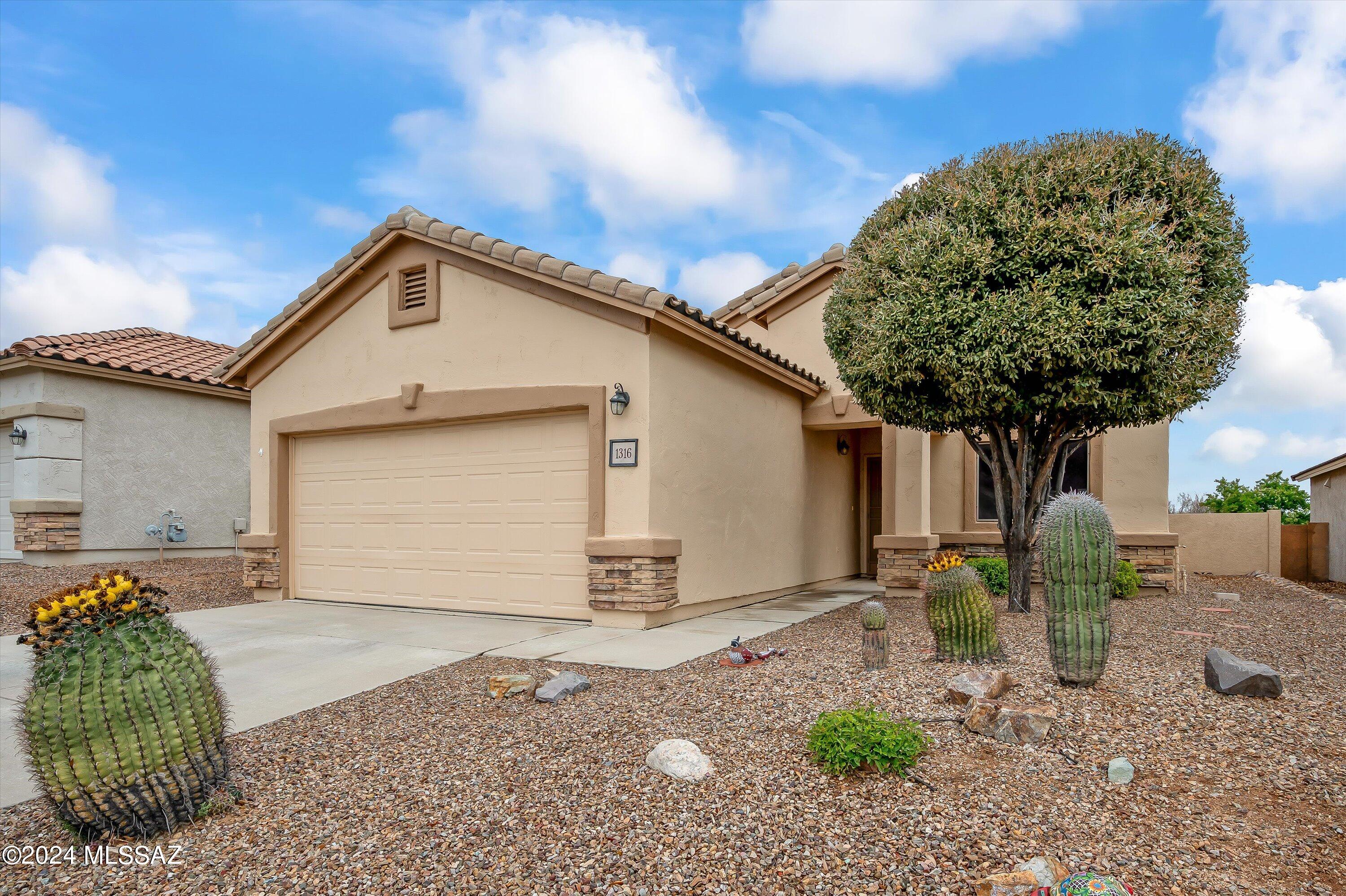 This Rancho Resort home in the Las Brisas section offers a captivating blend of comfort and natural beauty. Situated on a generous lot that extends to an open area filled with mesquite and saguaro, it promises a serene environment for residents to enjoy.  The kitchen, a focal point for many, boasts ample space, making it a dream for culinary enthusiasts. With granite countertops complementing the staggered cabinetry, it provides both functionality and elegance. A pantry closet adds to the convenience, ensuring that ingredients and supplies are always within easy reach. Additionally, the kitchen and living room offer picturesque views of the back patio and the surrounding open space, allowing residents to bask in the sights and sounds of nature, including the diverse birdlife. The primary en suite is a welcoming space, featuring a generous  walk-in closet and a well-appointed primary bathroom, ideal for unwinding after a long day. Similarly, the guest bedroom offers comfort and practicality, boasting two walk-in closets and direct access to the guest bathroom, ensuring privacy and convenience for guests.
Moreover, the two-car garage is not just a space for parking vehicles but also offers added storage solutions with two overhead storage racks. Furthermore, its extended four feet provide additional space for storage or workspace, catering to various needs and preferences.
In essence, this Rancho Resort home presents an inviting blend of functionality, comfort, and natural beauty, inviting prospective homeowners to explore its charms firsthand.
