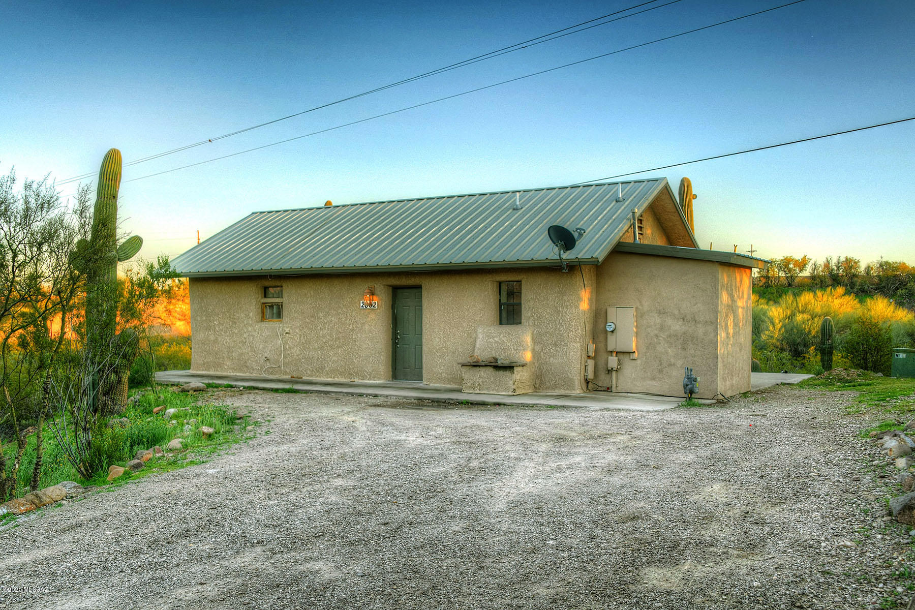 VIEWS, VIEWS, VIEWS!  FANTASTIC OPPORTUNITY to own a Terrific ''WELL PRICED'', NEWER, Smaller Single-Story Home Perfectly Situated overlooking the CATALINA MOUNTAINS!!!  This Home has STRAWBALE & FRAME Construction with a METAL ROOF on an OVERSIZED LOT with PRIVACY and Plenty of Room to Roam.   A Simple Floor Plan with a Kitchen boasting Granite Counters, Maple Cabinets, and Stainless Steel Appliances.  NO HOA!  No ''Interior Steps'' in this 1 Bedroom and 2 Bath Home waiting for your own Personal Touch.  Kitchen Adjacent to the GREAT-ROOM!  Laundry Room with Additional Storage!  Refrigerator Conveys!  Very CONVENIENT LOCATION close to Shopping, Schools, Downtown and Freeway, and Wonderful Restaurants! WELCOME HOME!!!