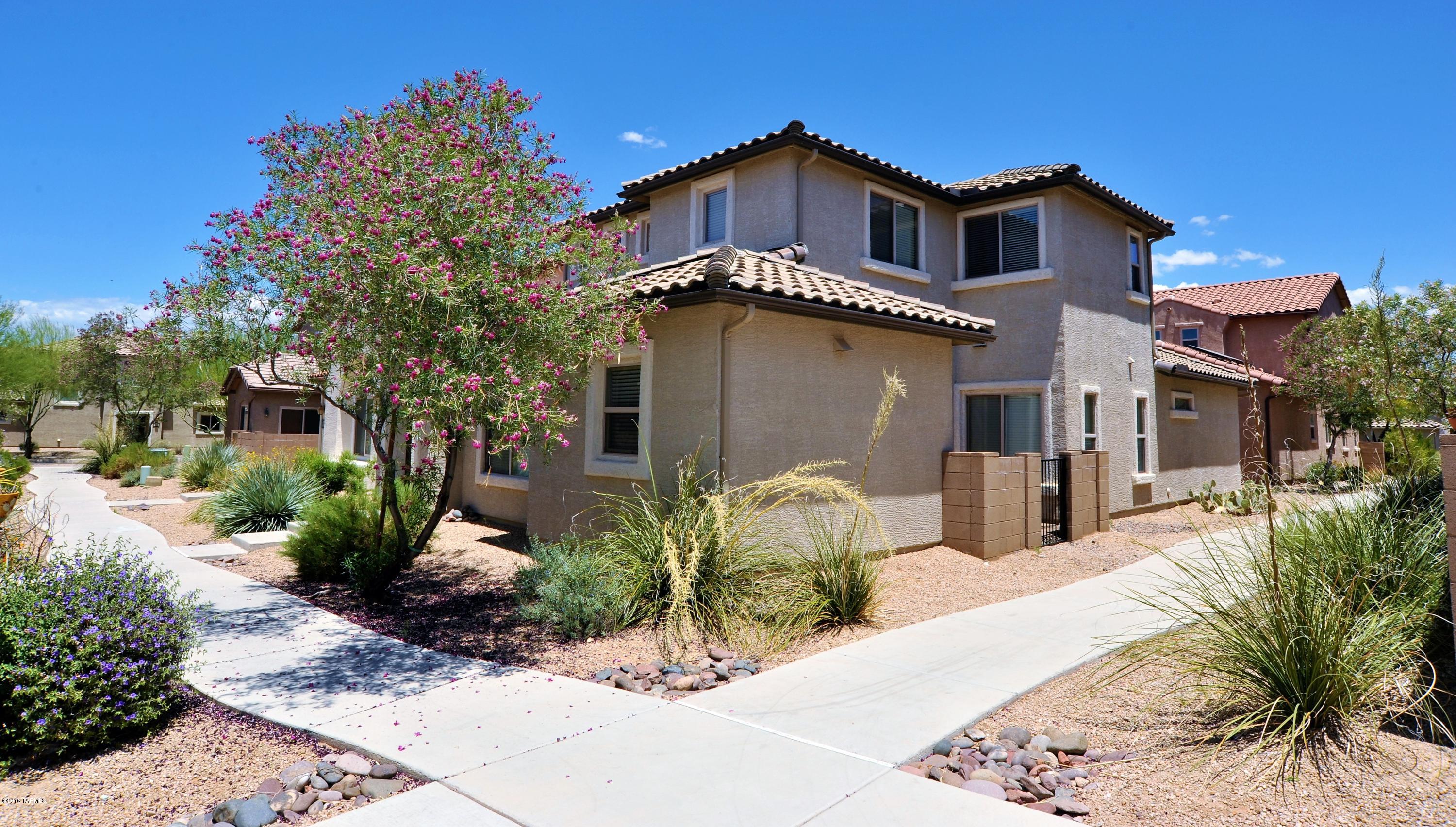 Beautifully maintained, 1769 sq ft, 4 bedroom, 3 bath, 2 story home in the tree lined Sierra Morado community. Freshly painted interior with Loft that could be used as a play area or homework station, with 3 nice sized bedrooms upstairs and the Master downstairs. Plus a private patio off the Kitchen, large laundry room and storage closet, 2 single car garages with a Solar Water Heater all wrapped up in the close knit master planned community of Civano.  Take advantage of the community pool, garden, trails and the volleyball court across the street. This southeast side neighborhood is a gem and a must see!