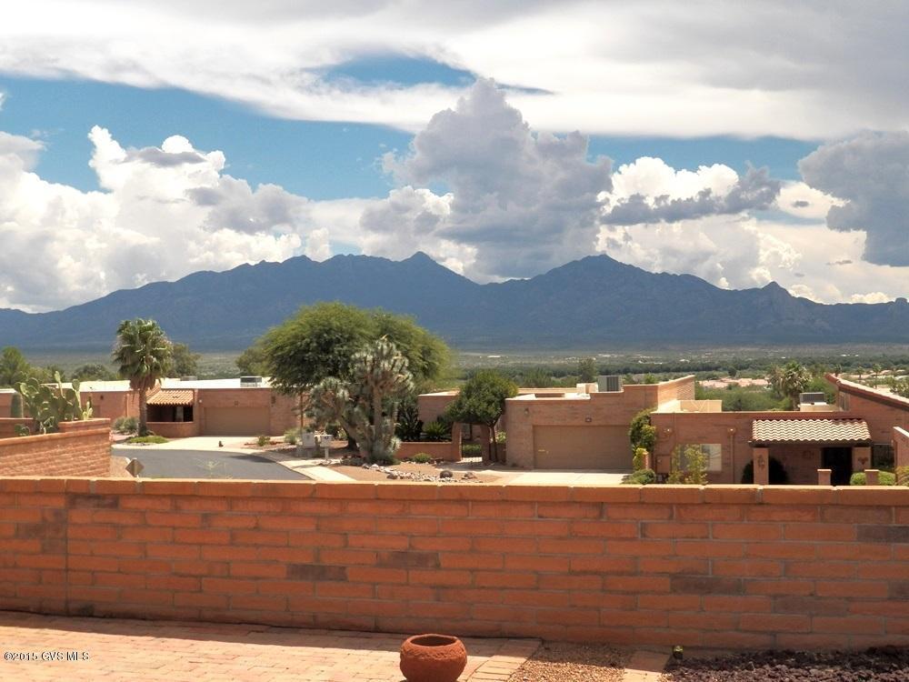 Fabulous panoramic mountain view stretching south down the Santa Cruz Valley to Tubac and beyond. Private wrap around patio. Good bones. Interior needs some updating. Roof recoated 8-2015 with warranty. Terminix termite warranty. Home warranty provided for 1 year.