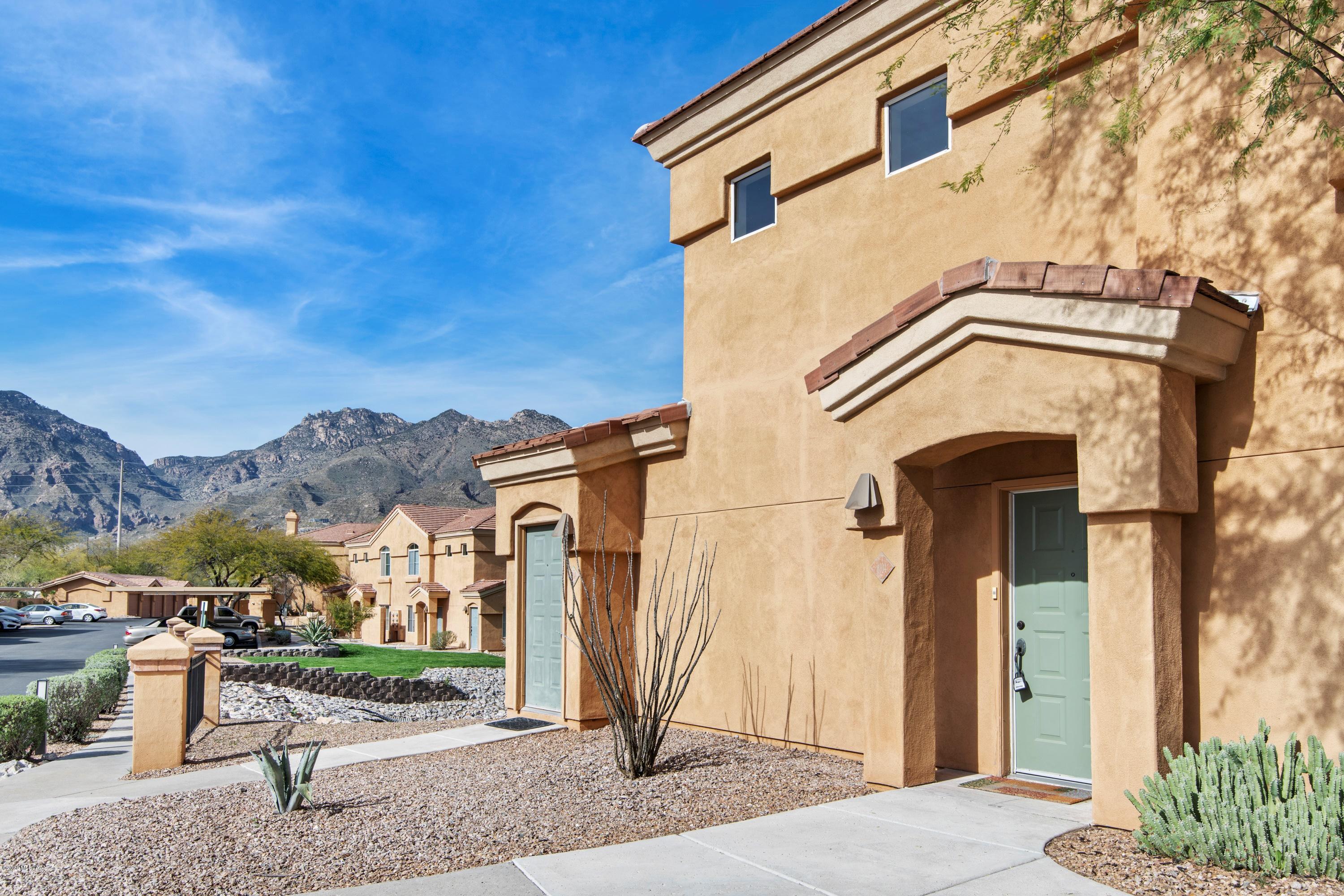 Upgraded corner lot condo with amazing Catalina Mountain Views in the Catalina Foothills.  Highly sought after location in Pinnacle Canyon. Open contemporary split bedroom plan with lots of natural light.  Amenities include gated entry, contemporary clubhouse with fully equipped gym, pool and spa and close to Tucson's best resorts, hiking and shopping.  Freshly updated with new paint, carpet and flooring throughout.  Master bedroom is well appointed with walk-in closet, en-suite bathroom and covered patio overlooking the perfectly manicured green grass and breathtaking Catalina Mountain views for your morning coffee.  Perfect lock and leave including 1 car garage. All furniture available.
